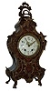 Lenzkirch, Germany, shelf or mantel clock, burl walnut veneered case, heavily ornamented with gilt, cast brass mounts in the rococo style, gilt bezel with similar decoration, Arabic numeral white enamel dial with polychrome enamel floral festoons, fancy gilt hands, 8 days, time and strike, movement, serial No. 133811, c1890
