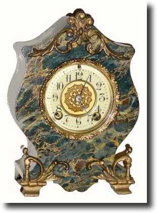 C.1900, New Haven Clock Co., LESLIE, miniature enameled iron — Antique Clocks Price Guide