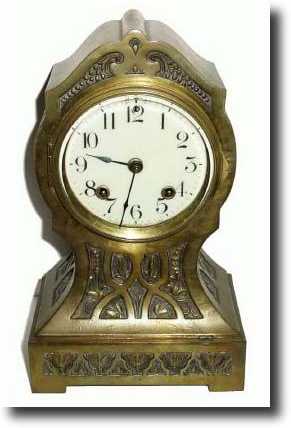 C.1911, Ansonia Clock Co., "THEBES" brass over iron mantel — Antique Clocks Price Guide