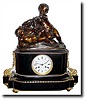 C.1820, French, Bronze Figural clock, a wonderful motif of two young boys feeding grapes to their pet goat.
