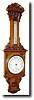C.1900, English, Aneroid Wall Barometer, in a great oak case,