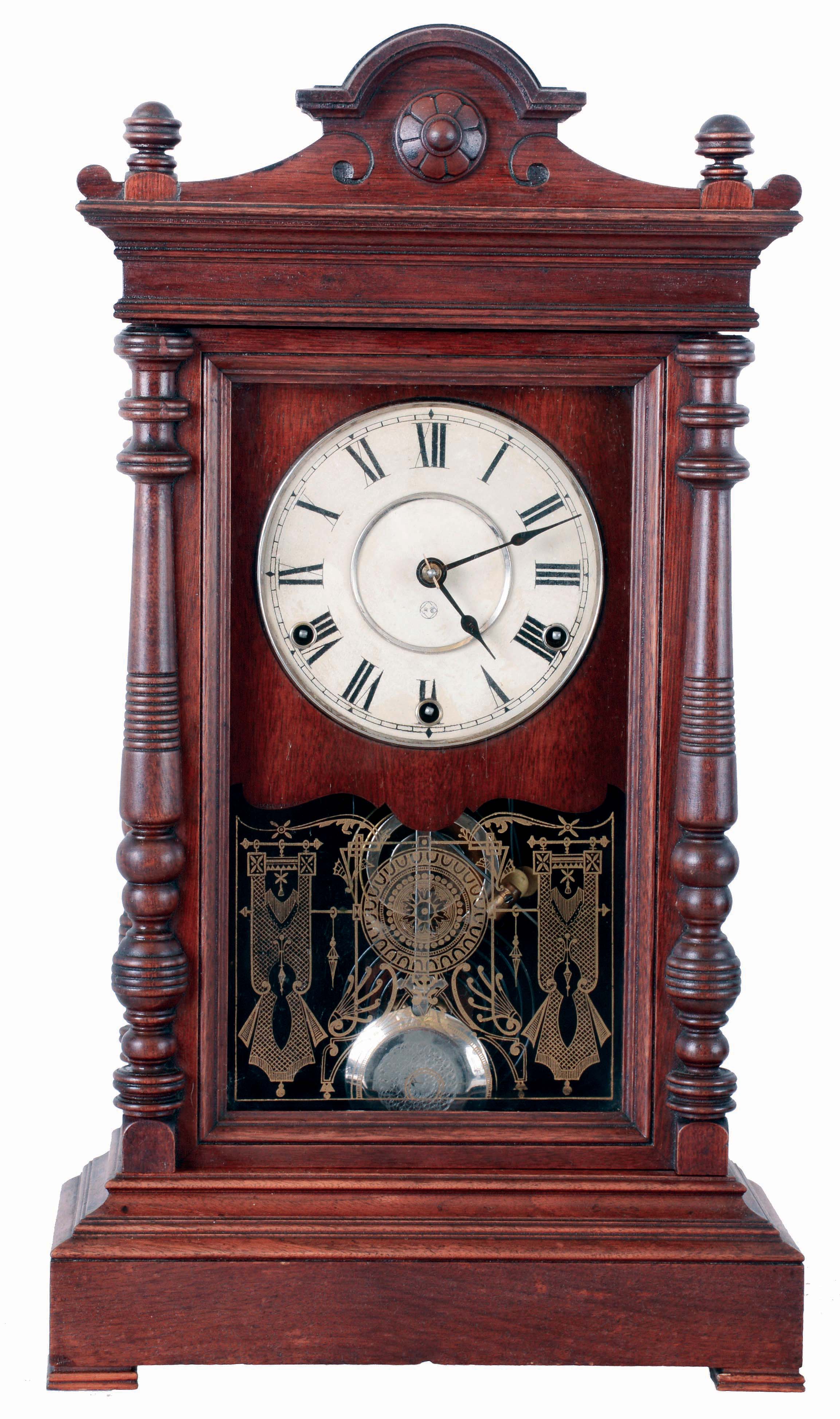 Seth Thomas Clock Co., Thomaston, Conn., "Atlas" mantel clock in a walnut case with three train, 8 days, spring driven movement, striking the quarter hours on 2 cup bells and hours on a cathedral bell, c1887. — Antique Clocks Price Guide