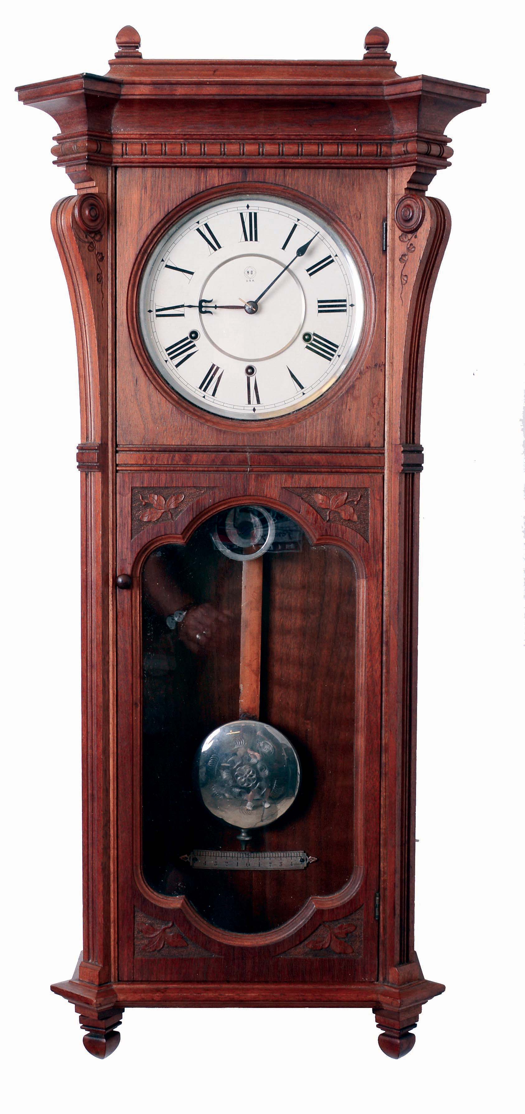 Seth Thomas Clock Co., Thomaston, Conn., "Marcy" wall clock in a walnut case with a three train, 8 days, spring driven movement, striking the quarter hours on 2 cup bells and the hours on a cathedral gong, c1886. — Antique Clocks Price Guide