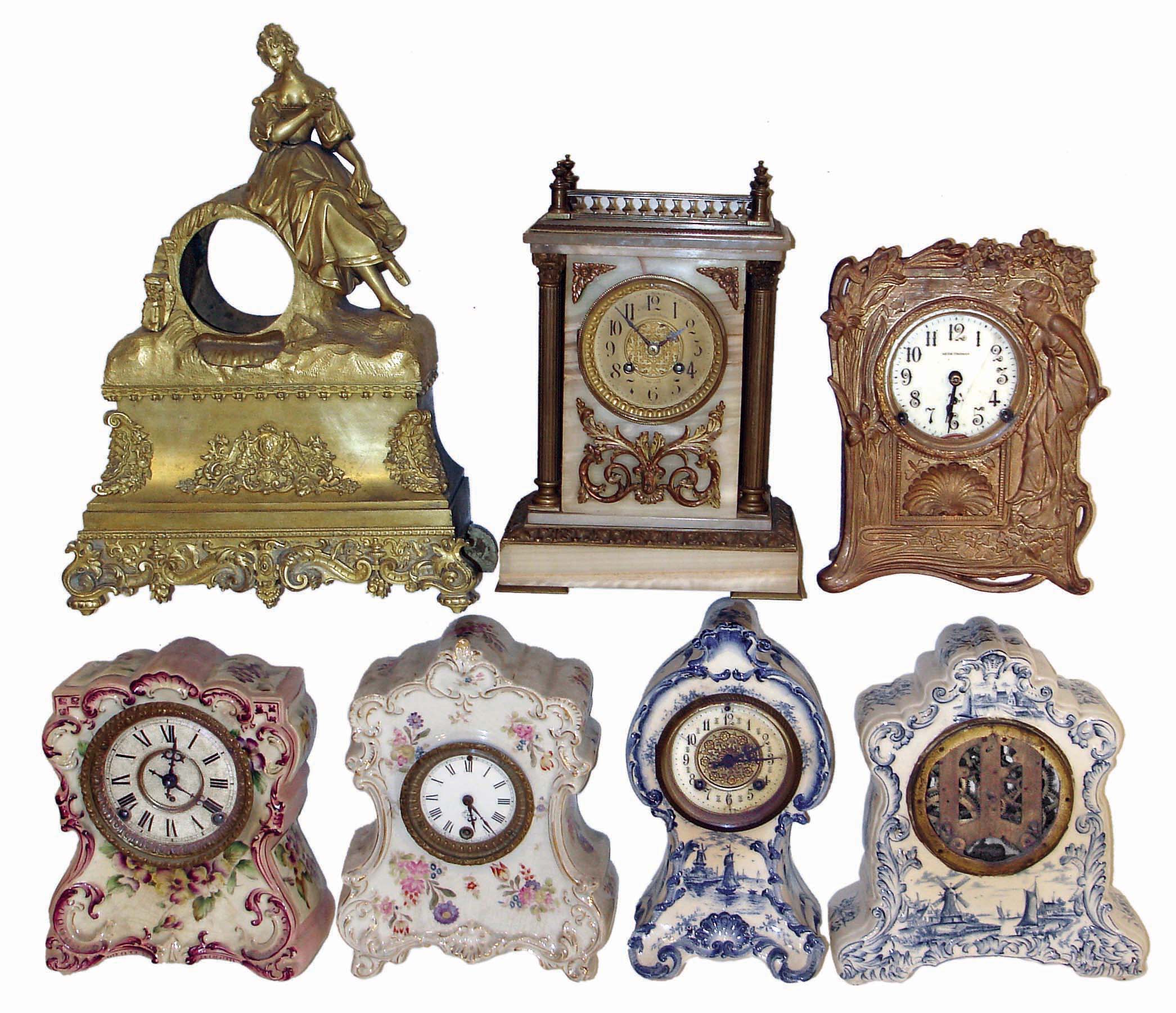 Clocks &amp; Statues- 21 (Twenty-one): 4 cast metal seated figures; 1 French gilt metal case (no movement); 4 American porcelain case; 1 onyx French sold by Camerden &amp; Forester, New York; Seth Thomas Art Nouveau metal case; 1 400 day; French marble with balance wheel Duverdrey &amp; Bloquel movement; 6 small celluloid desk clocks; 1 United movement with animated dial; French alabaster and gilt metal figural; late 19th and early 20th centuries — Antique Clocks Price Guide