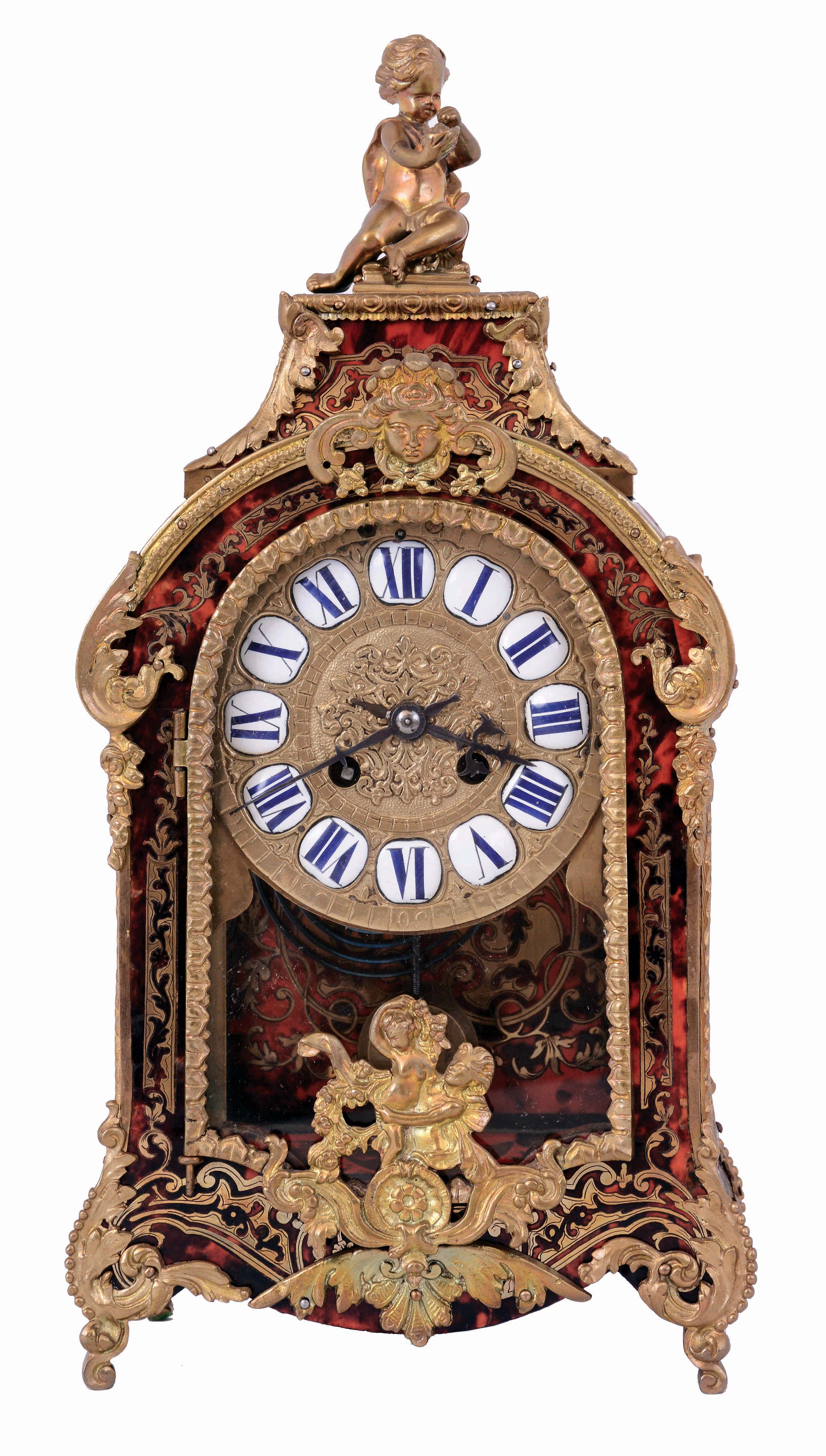 France, mantel clock, the boulle case with brass inlaid horn, dyed to imitate tortoise shell, cast foliate mounts and figural finial, cast brass dial with Roman numeral, white enamel cartouches, blued steel hands, 8 days, time and strike pendule a Paris movement, c1900 — Antique Clocks Price Guide