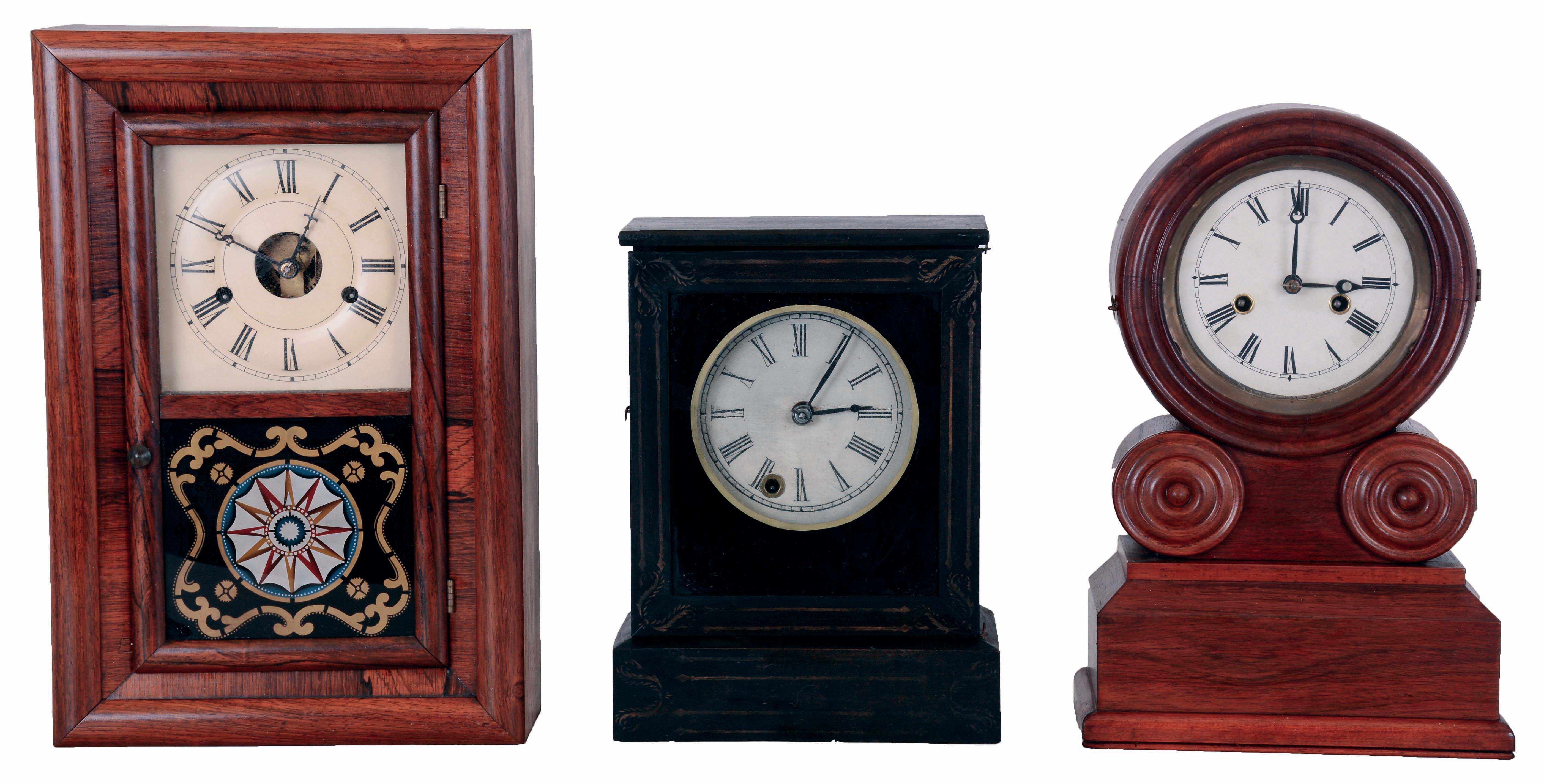 Clocks- 3 (Three) American: (1) Chauncey Jerome, 30 hours, spring driven brass movement with a brass mainspring cottage timepiece, c1850; (2) E. Ingraham &amp; Co., 30 hours, time and strike, spring driven brass movement "Grecian" shelf clock, c1875; (3) Seth Thomas, "Round Band" 30 hours, time and strike, with round plate movement, c1870. — Antique Clocks Price Guide