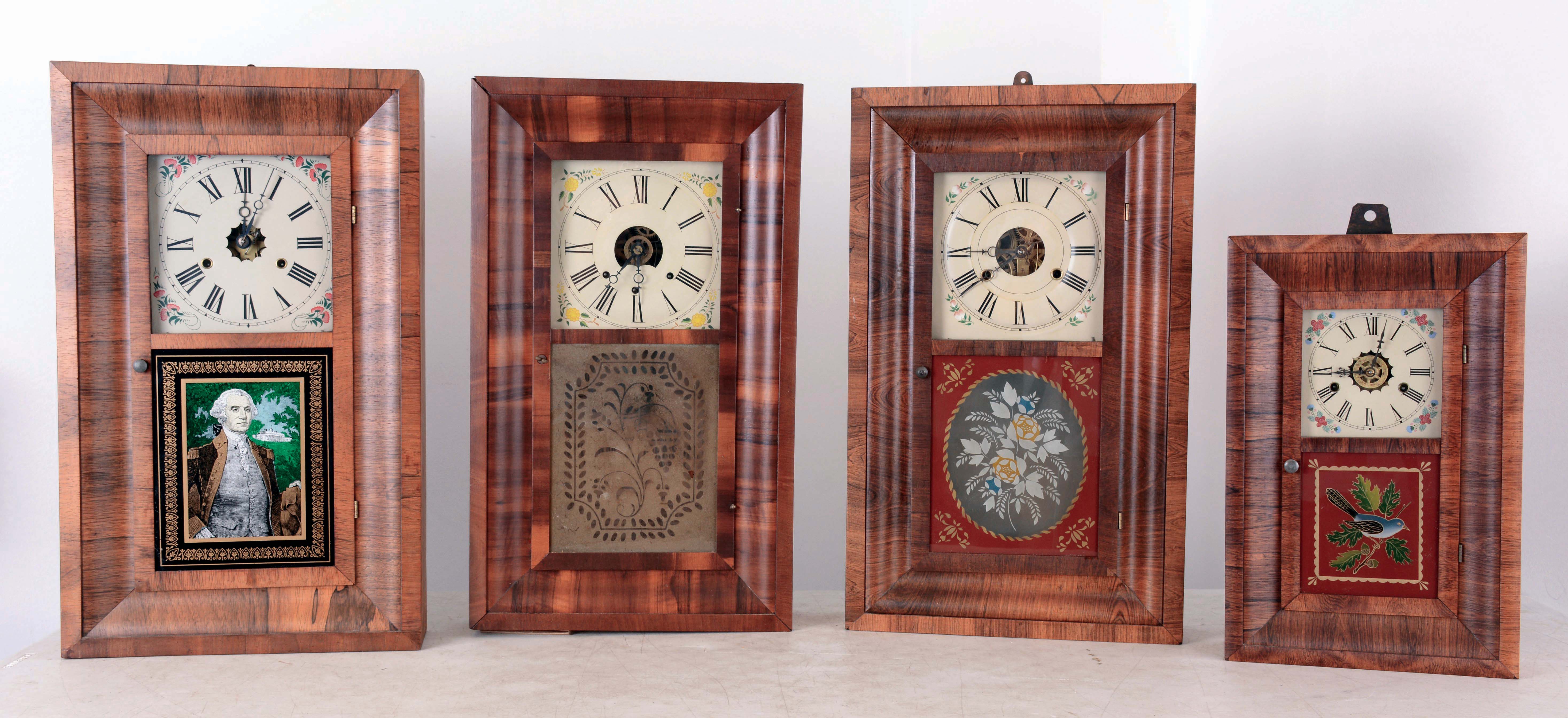 Clocks- 4 (Four) American OG's: (1) Gilbert Mfg. Co., Winsted, Conn mini OG in rosewood case with 30 hours, spring driven, time, strike and alarm movement, c1870; (2) New Haven Clock Co., New Haven, Conn OG in rosewood case with 30 hours, spring driven, time and strike movement, c1875; (3) William S. Johnson, NYC, OG in rosewood case with weight driven, 30 hours, time, strike and alarm movement, c1870; (4) Seth Thomas Clock Co., Thomaston, Conn OG in a rosewood case with 30 hours, weight driven, time and strike movement, c1875. — Antique Clocks Price Guide