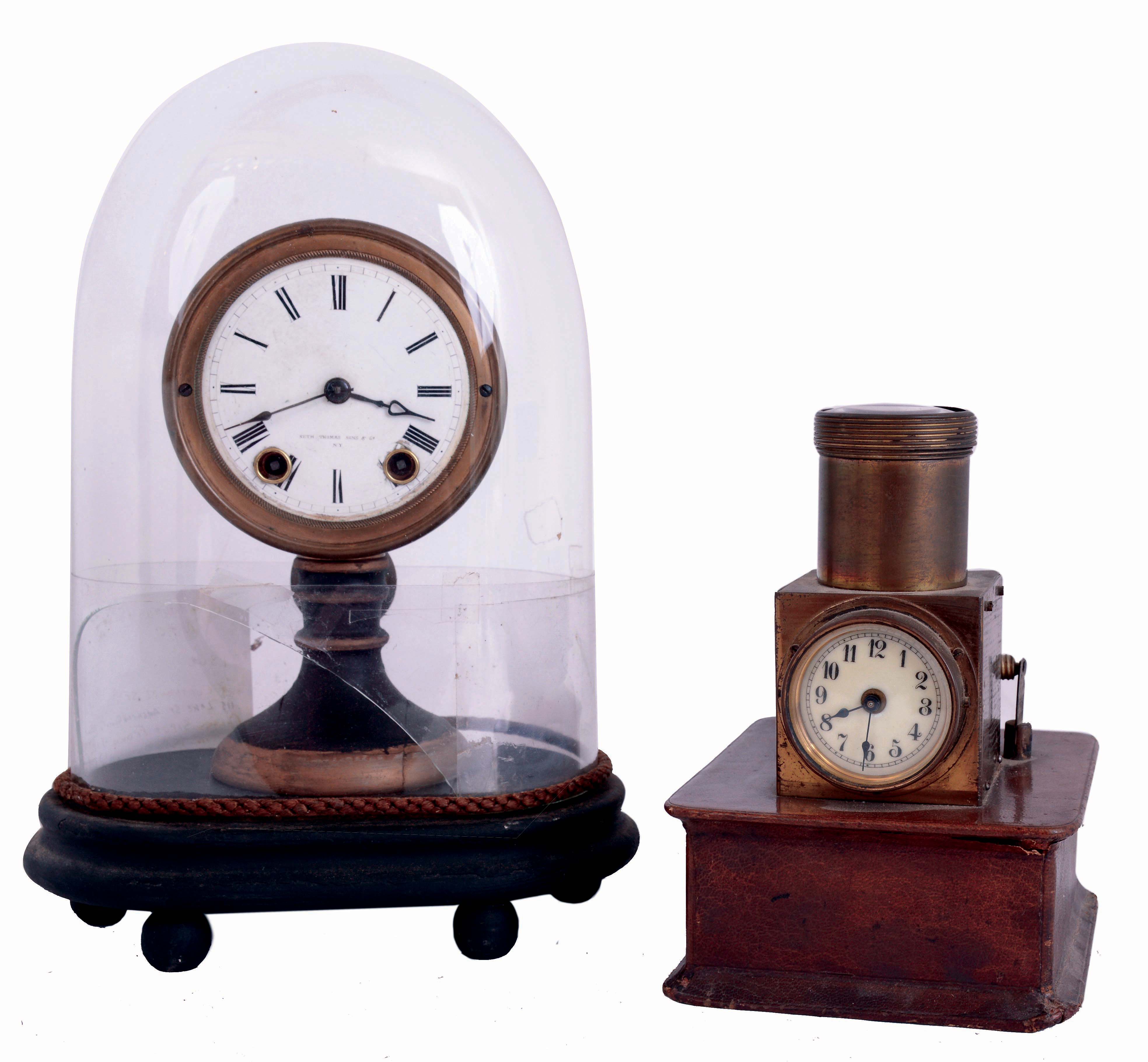 Clocks- 2 (Two): (1) Seth Thomas' Sons &amp; Co., New York, candle stand clock, enamel dial, 8 day timepiece with glass dome, (2) English night projection table clock, 30 hour timepiece on wooden base, marked "J.C. Vickery Regent St W." — Antique Clocks Price Guide
