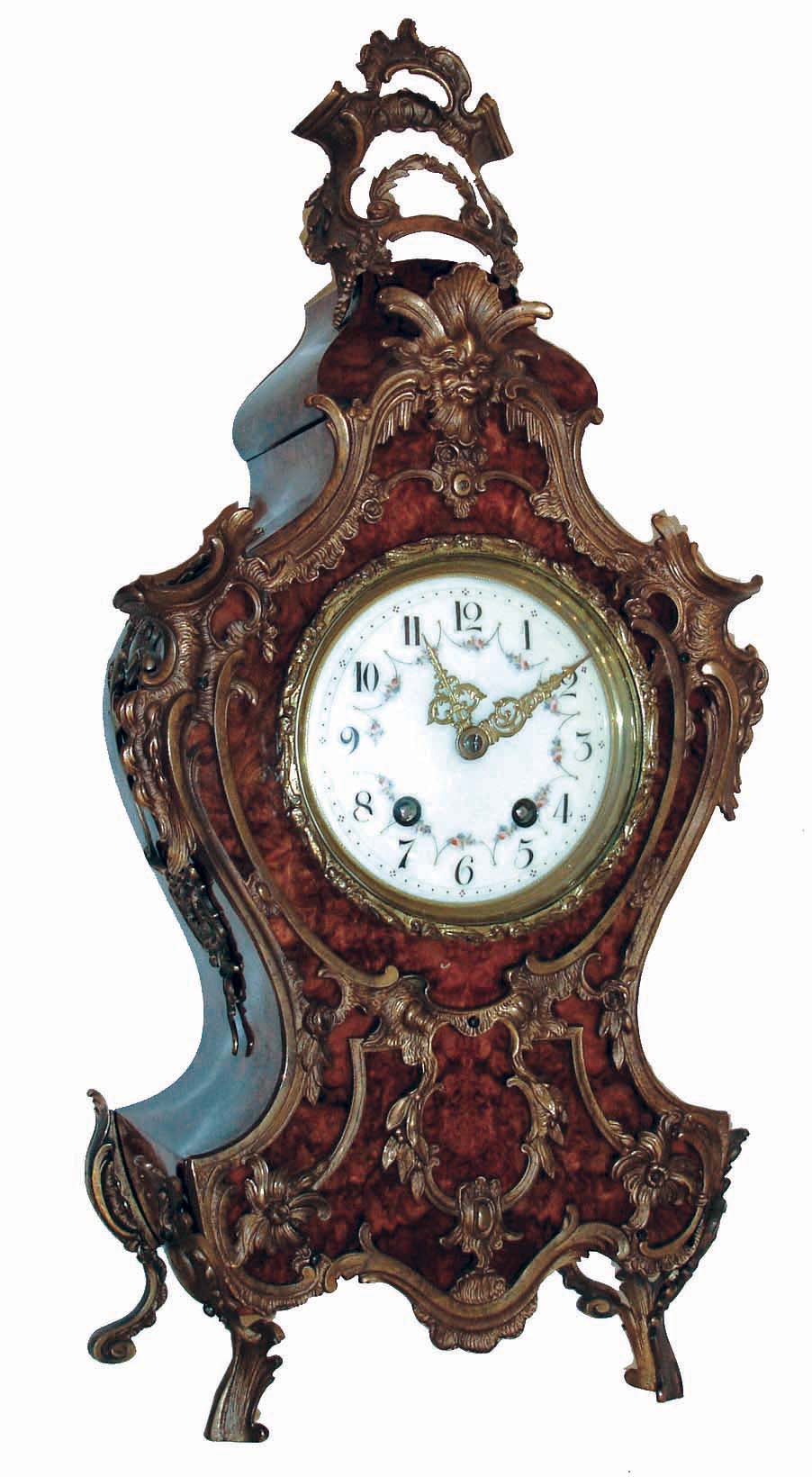 Lenzkirch, Germany, shelf clock in the Neuchatel style, burl walnut veneered case, heavily ornamented with gilt, cast brass mounts in the French style, gilt bezel with similar decoration, Arabic numeral white enamel dial with polychrome enamel floral festoons, fancy gilt hands, 8 days, time and strike movement, serial #133811, c1890 — Antique Clocks Price Guide