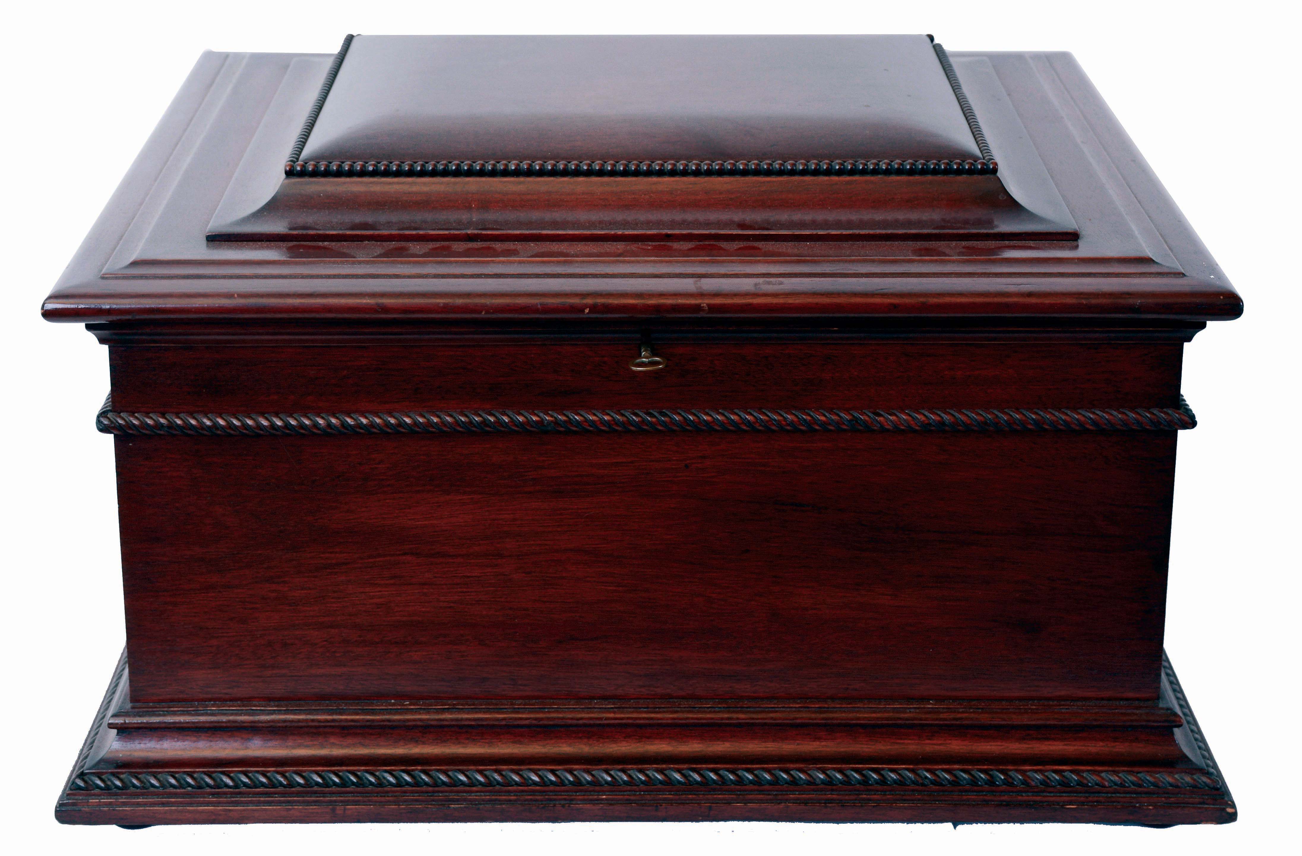 Regina Musical Box Co., Rahway, N.J., 15" Music Box with 31 discs, mahogany case with rope molded cavetto and astragal base, stepped, molded lid with bead molding, inside of lid with music themed lithograph, serial # 39128, c1900, and with instructions for operating, a pamphlet on repairing music boxes, and one on the origins and development of the music box — Antique Clocks Price Guide