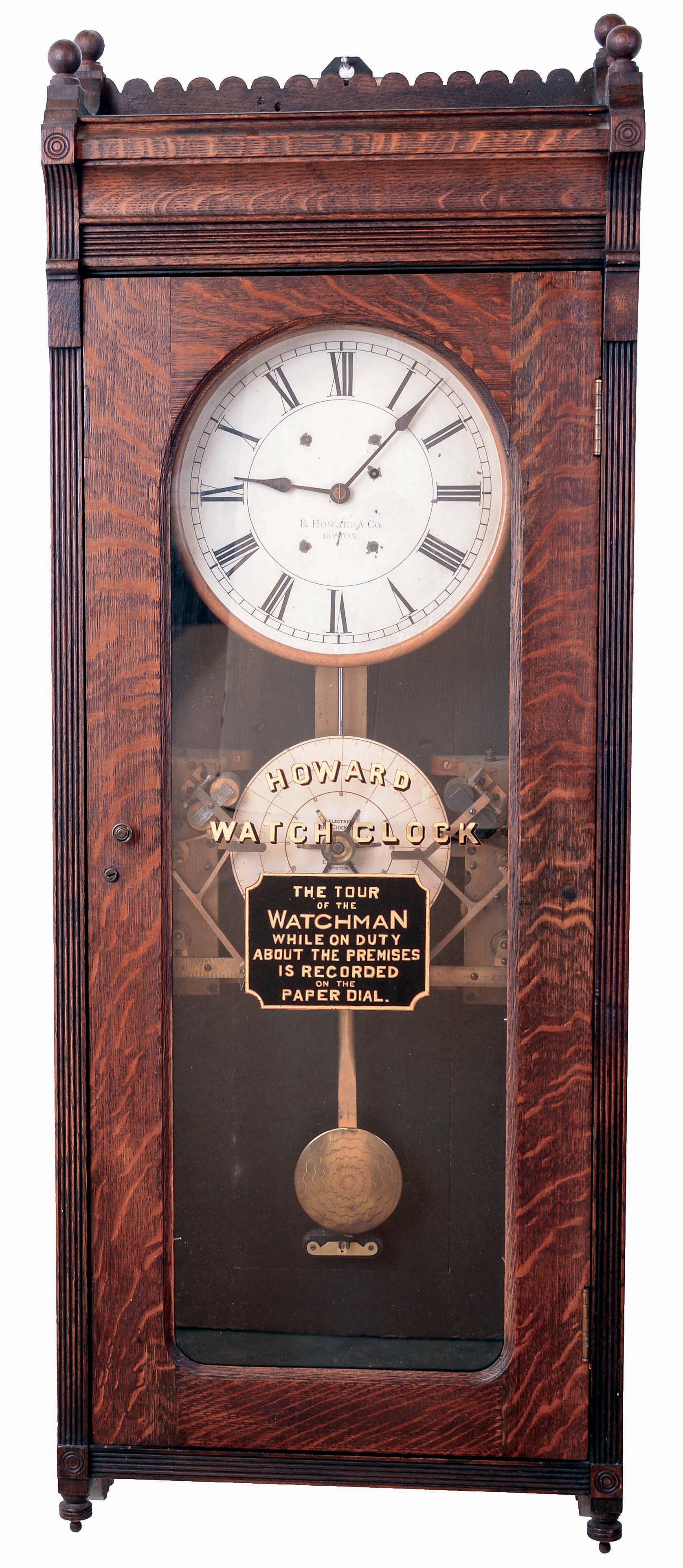E. Howard &amp; Co., Boston, Mass., "Watchman's Clock" with punch stations for two watchmen, wall clock, 8 days, time only, weight driven movement in an oak case with painted metal dial and reverse lettering on glass, c1888 — Antique Clocks Price Guide