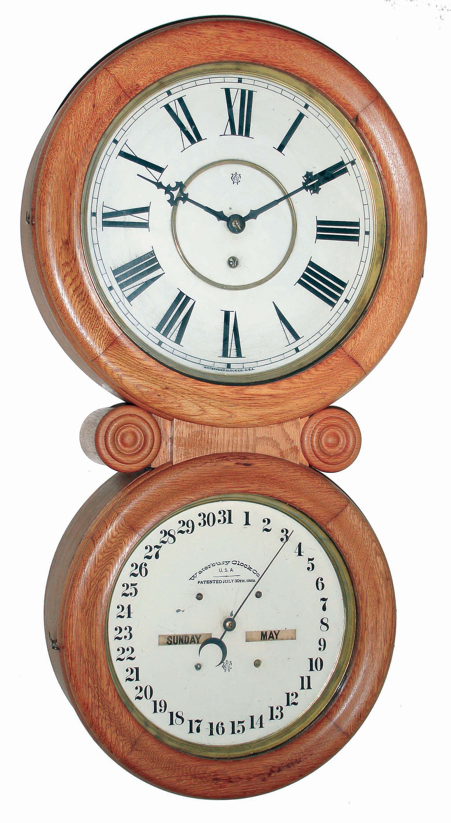 Waterbury Clock Co., Waterbury, Conn., "Calendar No. 34" oak cased, double dial, 8 days, time only wall clock, c1890 — Antique Clocks Price Guide