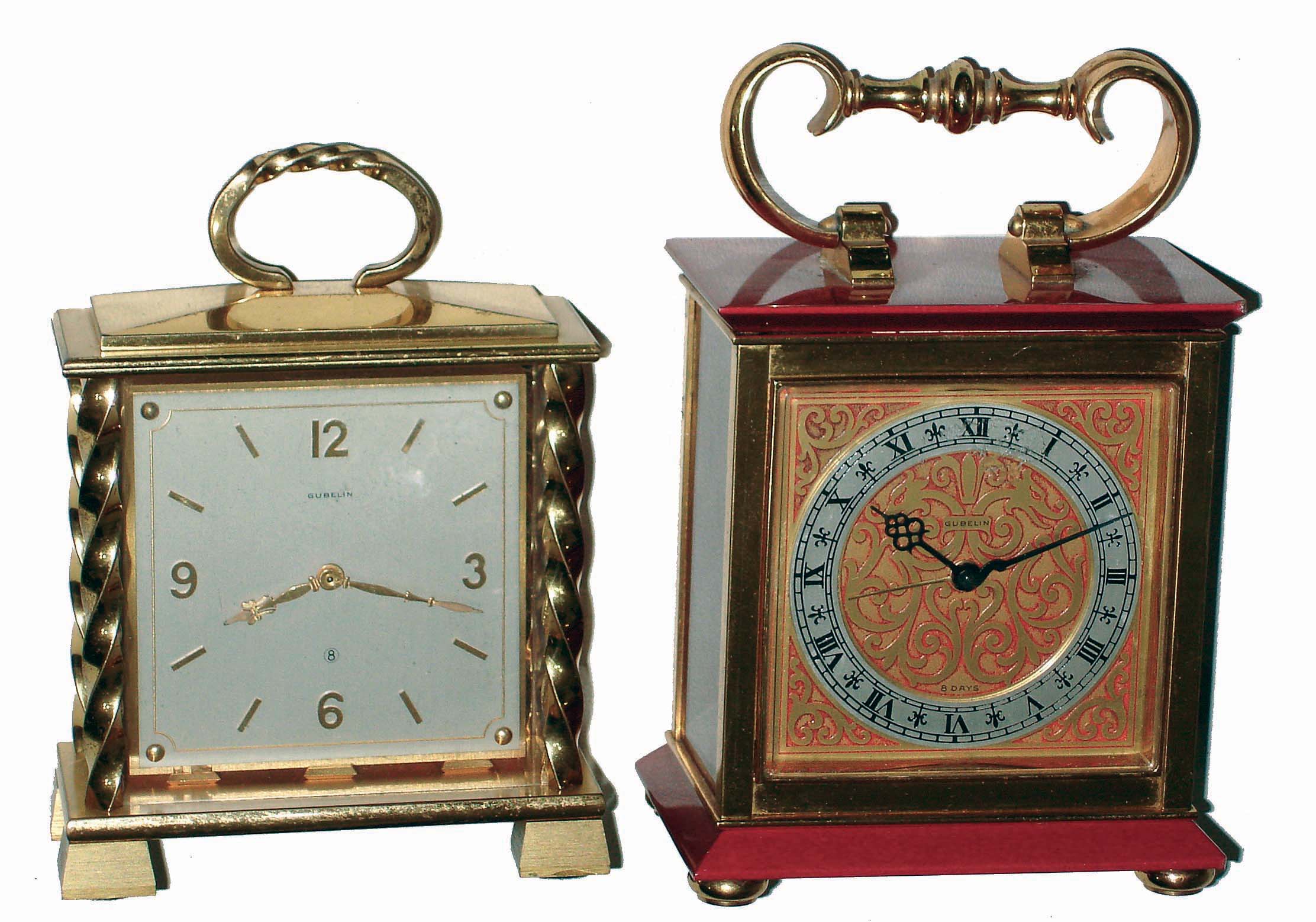 Clocks- 2 (Two) Gubelin, Swiss, 8 days, brass and glass desk timepieces: one alarm with red enamel panels; one double-side partner's clock with twisted columns; mid 20th century — Antique Clocks Price Guide