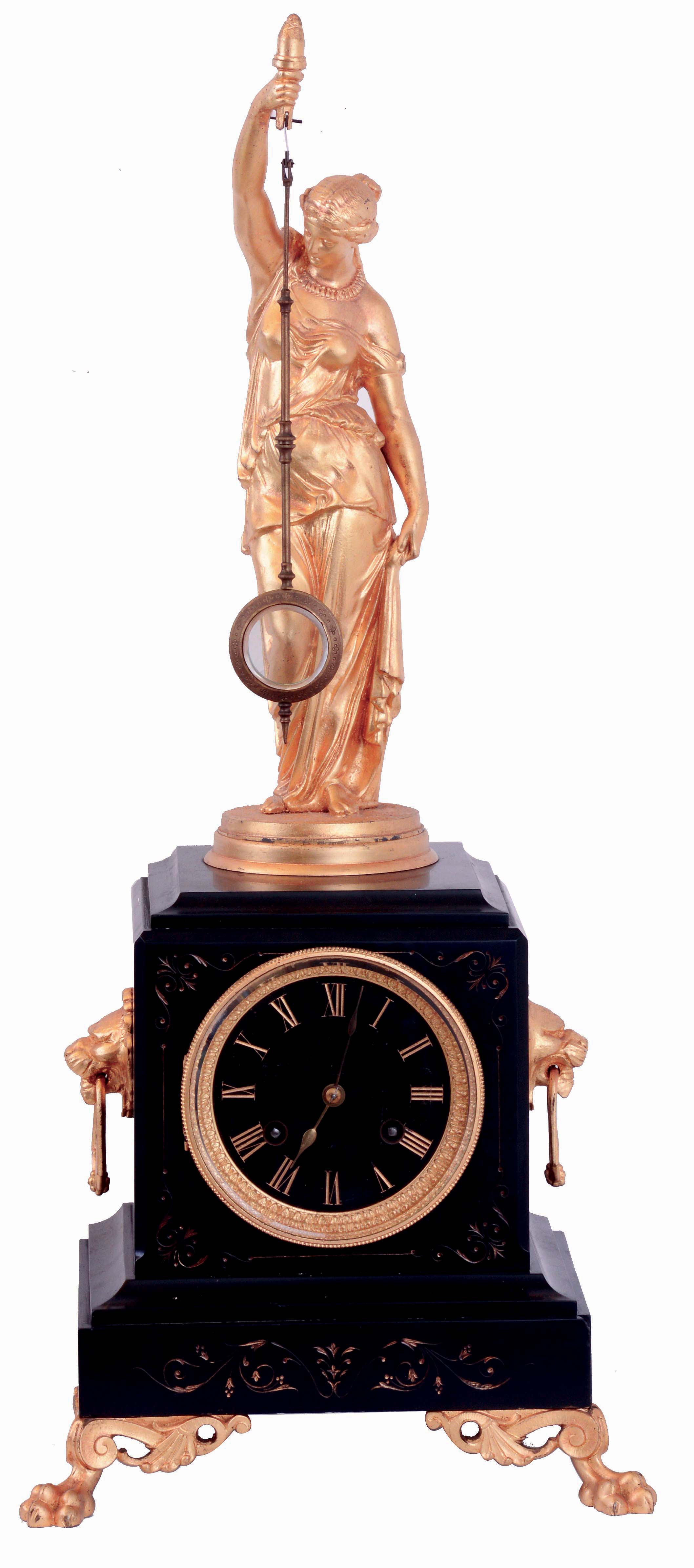 Guilmet, France, mystery clock, black slate case with incised line decoration, lion mask handles, and paw feet, surmounted by a gilt female figure, her right hand held aloft with a torch, and suspending the pendulum. Pendulum impulsed through the nearly imperceptible movement of the gilt base on which the she stands, gilt Roman numeral black slate dial, gilt spade hands, 8 days time and strike movement with crank and stirrup escapement, back plate signed "Brevete GLT S.G.D.G." and numbered 943, c1875 — Antique Clocks Price Guide