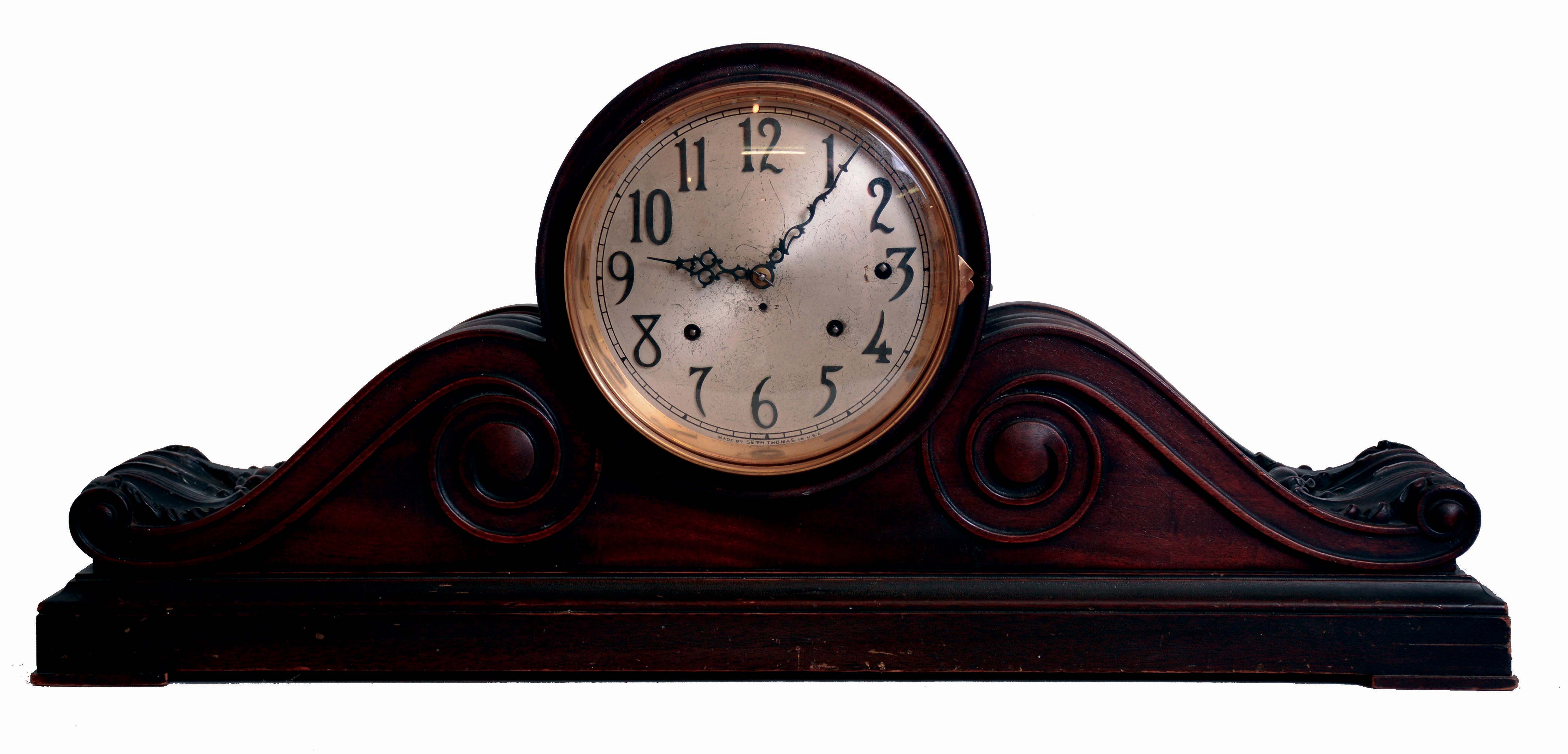 Seth Thomas Clock Co., Thomaston, Conn., "Chime Clock No. 58" shelf clock, 8 days, time, strike and Sonora chime on 5 bells, spring driven movement in a large carved tambour style mahogany case with a silvered brass dial and applied brass numerals, c1913 — Antique Clocks Price Guide
