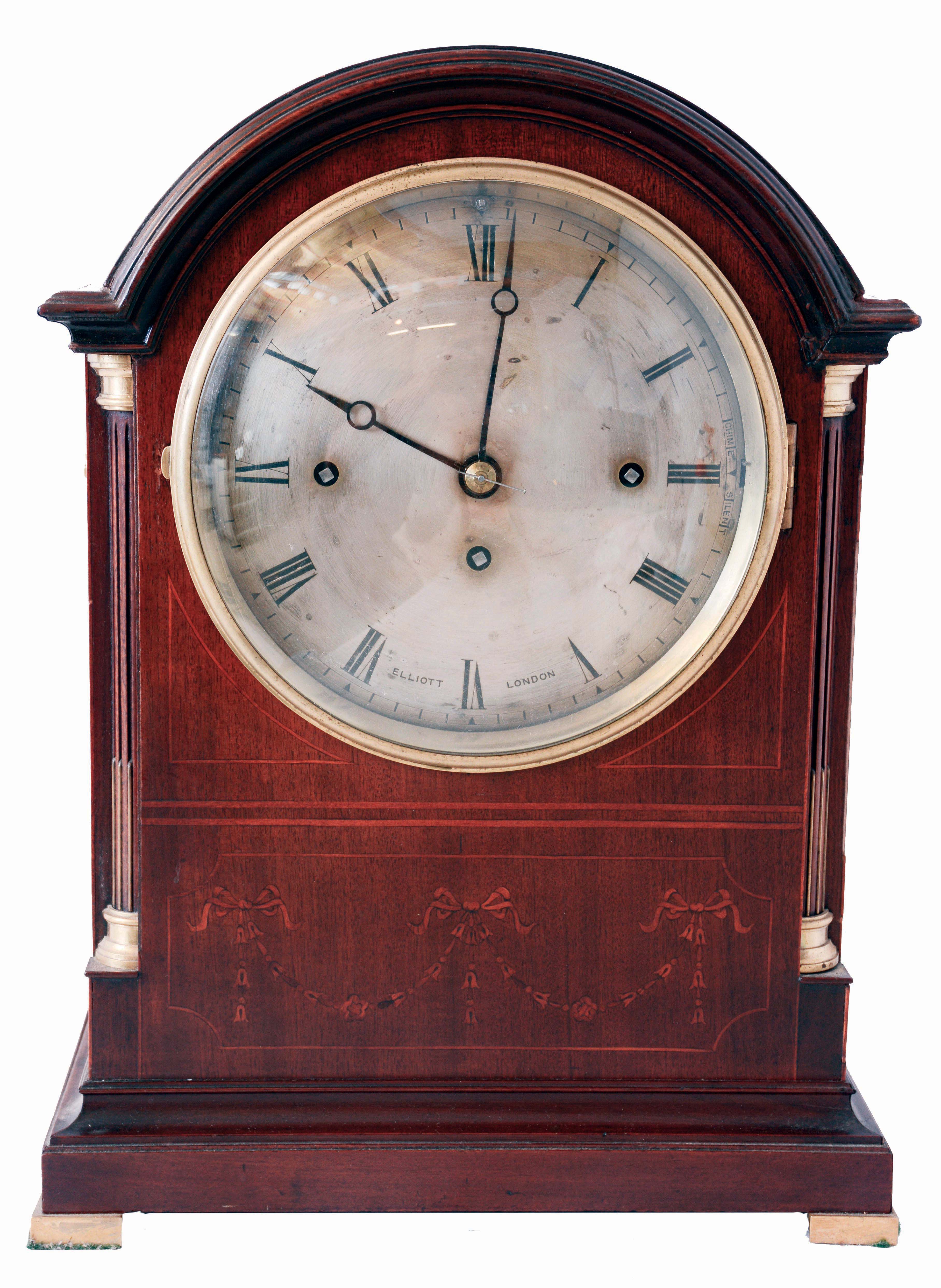 Elliott, London, bracket clock, mahogany case with with fine inlay in the neoclassical style, engaged quarter columns with brass capitals and bases, cast brass feet, handles, and frets, the bezel with convex glass, Roman numeral silvered dial with blued steel Breguet style hands, massive three train fusee movement with Westminster chimes at the quarters on four gongs, and counting the hours on a larger gong, c1900 — Antique Clocks Price Guide