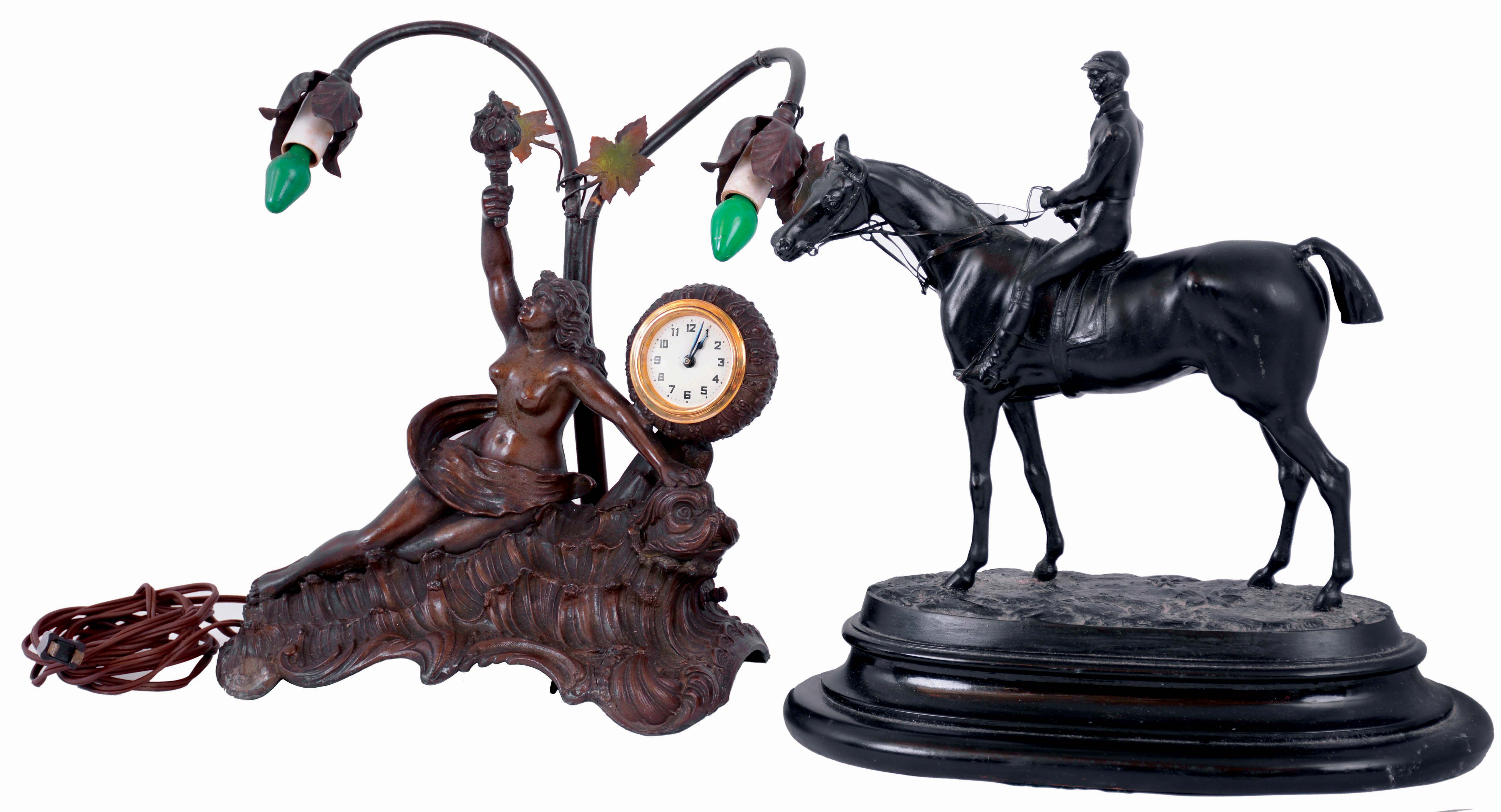 Clocks- 2 (Two): (1) William L. Gilbert Clock Co., "Curfew", painted wood, 8 days, time and strike mantel clock, c1913; (2) Cast spelter, 30 hours, backwind clock, with electrolier plus an equestrian statue on wood base, early 20th century — Antique Clocks Price Guide