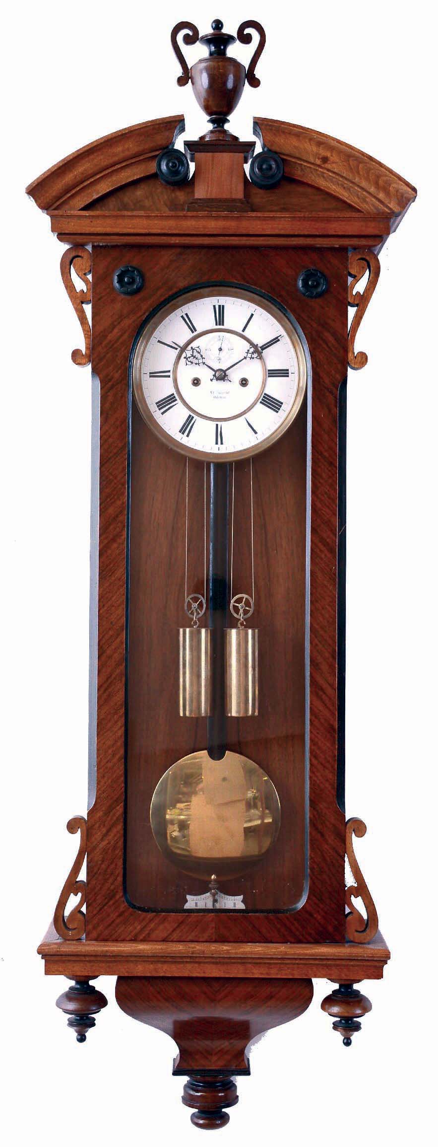Lenzkirch, Germany, hanging regulator, walnut and walnut veneer case with ebonized trim, the door with applied, pierced scrolls at top and bottom, molded, broken arch top, with turned, ebonized bosses flanking a central plinth with urn finial, bottom with deeply molded bracket and turned drops, Roman numeral white enamel dial with seconds bit below 12:00, and signed "M.C. Unserud, Odense", fancy blued steel hands, ebonized pendulum rod with polished brass ball, weight driven, time and strike movement, serial #340935, c1870 — Antique Clocks Price Guide