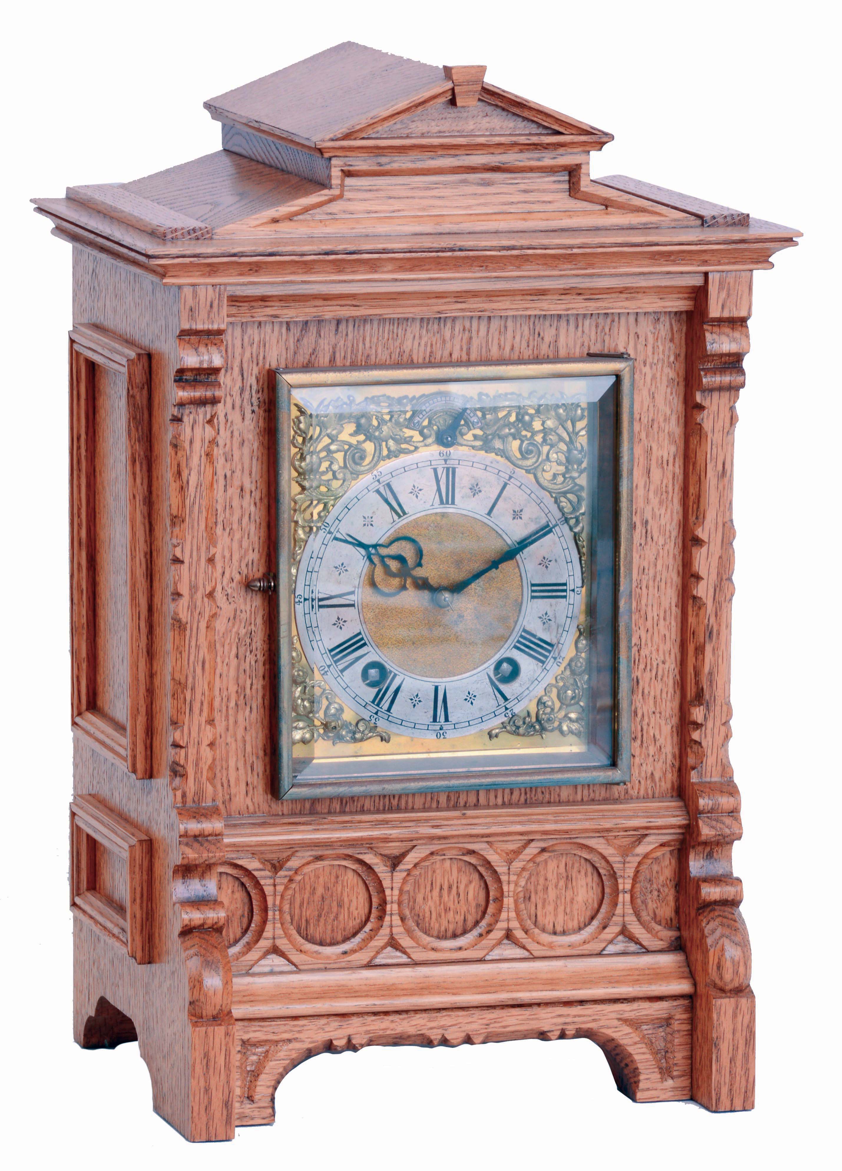 Lenzkirch, Germany, bracket clock, oak case of architectural form with carved and applied ornament, composite dial with Roman numeral silvered chapter ring and gilt spandrels, blued steel hands, 8 days time and strike movement with ting tang quarters on two gongs, serial #1358164 — Antique Clocks Price Guide