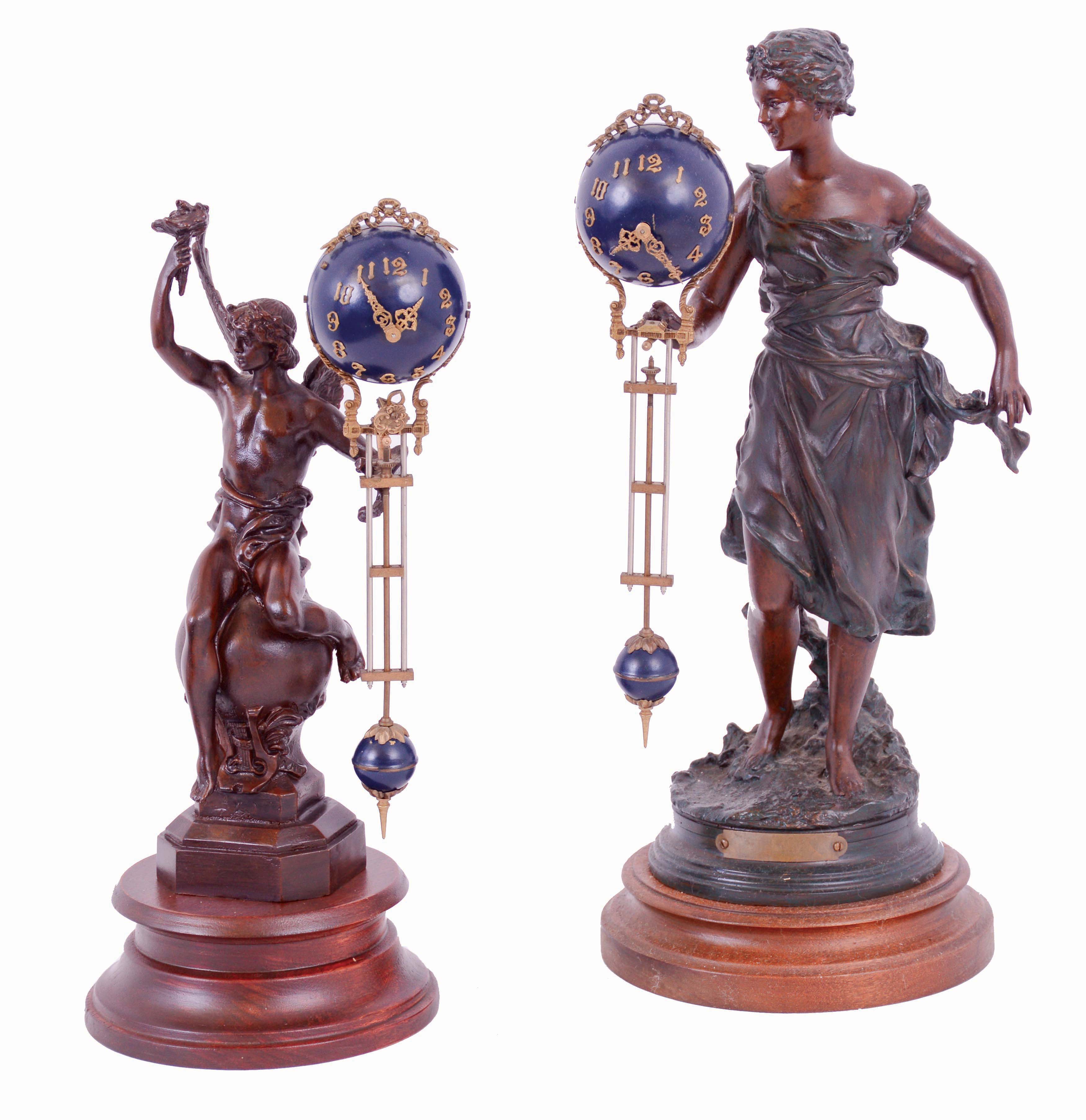 Clocks- 2 (Two) modern reproduction bronze swinging arm, 8 days, figural timepieces, on turned wood bases, c2000 — Antique Clocks Price Guide