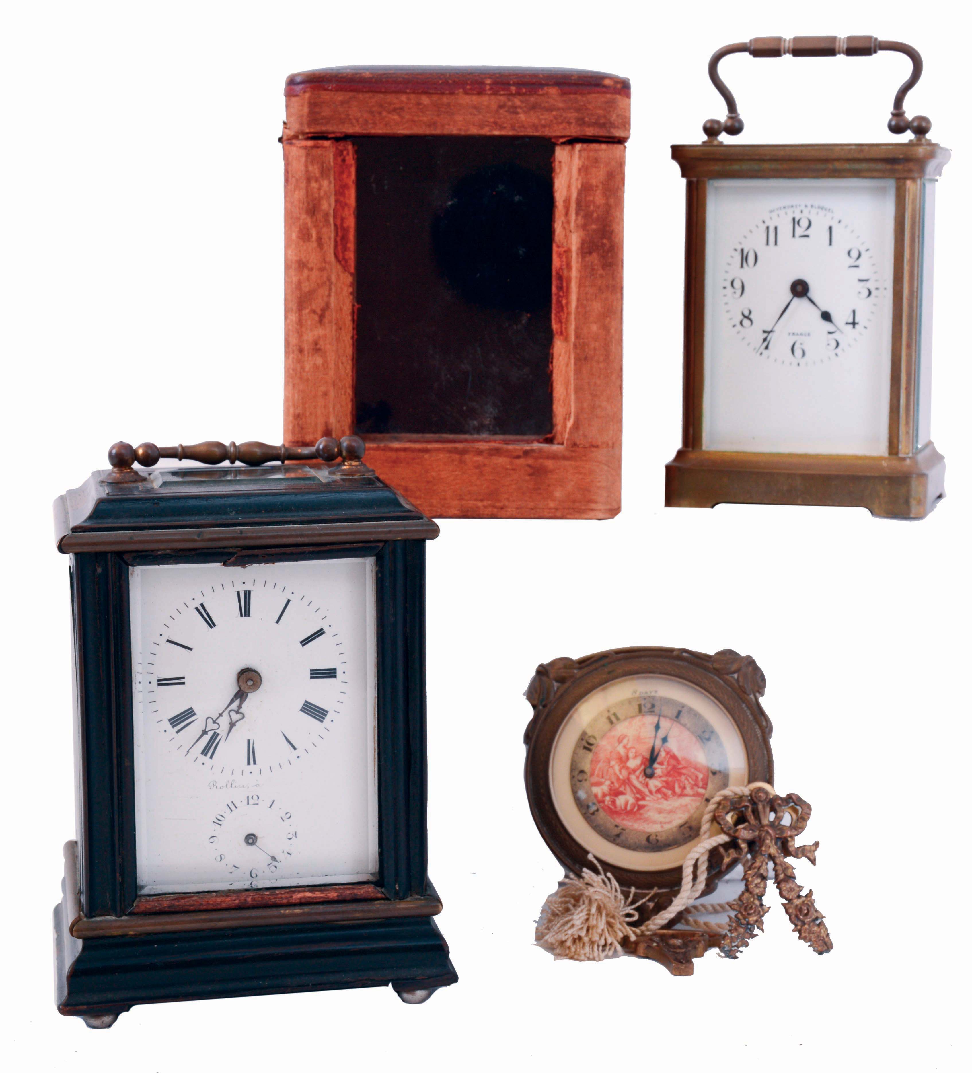 Clocks- 3 (Three): Two French carriage clocks, the first by Rollin a Paris, ebonized wood case with brass stringing and moldings, beveled glass at top and front, Roman numeral white enamel dial, 8 days time and alarm movement with lever platform, mid 19th century, the other marked "Duverdrey &amp; Bloquel", with gilt brass case, Arabic numeral white enamel dial, 8 days timepiece movement with cylinder platform, with outer case, c1900, together with a Swiss, 8 days chatelaine clock with lever escapement, c1900 — Antique Clocks Price Guide