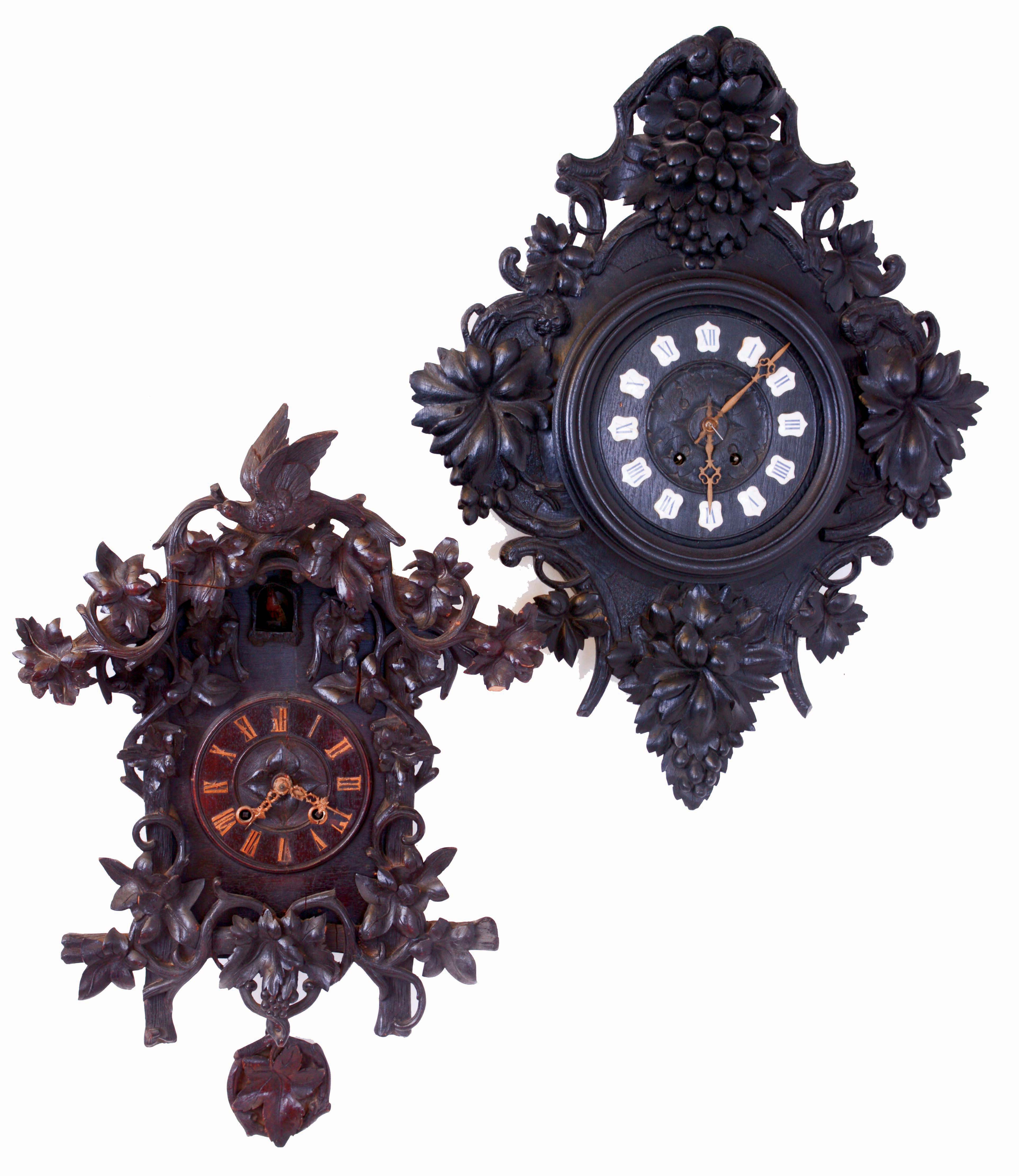 Clocks- 2 (Two) European carved walnut, 8 days, spring wound, time and strike wall clocks: French hanging clock with Paris retailer sticker inside, square brass movement; German Black Forest cuckoo, large movement with skeletonized cast brass plates; late 19th century — Antique Clocks Price Guide