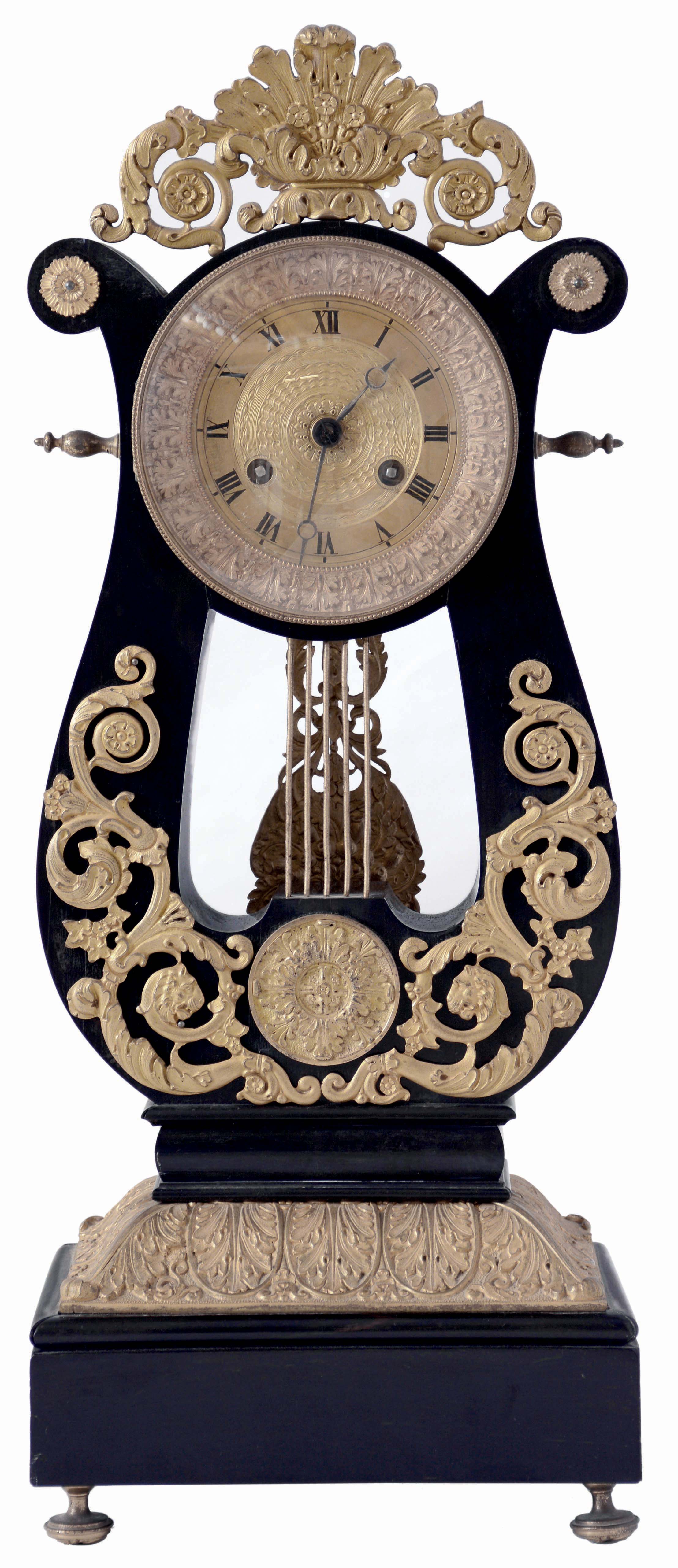France, lyre form mantel clock, ebonized wooden case with gilt ornament in the Grecian style, acanthus bezel with Roman numeral, engine turned gilt dial, blued steel Breguet style hands, 8 days, time and strike pendule a Paris movement, c1870 — Antique Clocks Price Guide