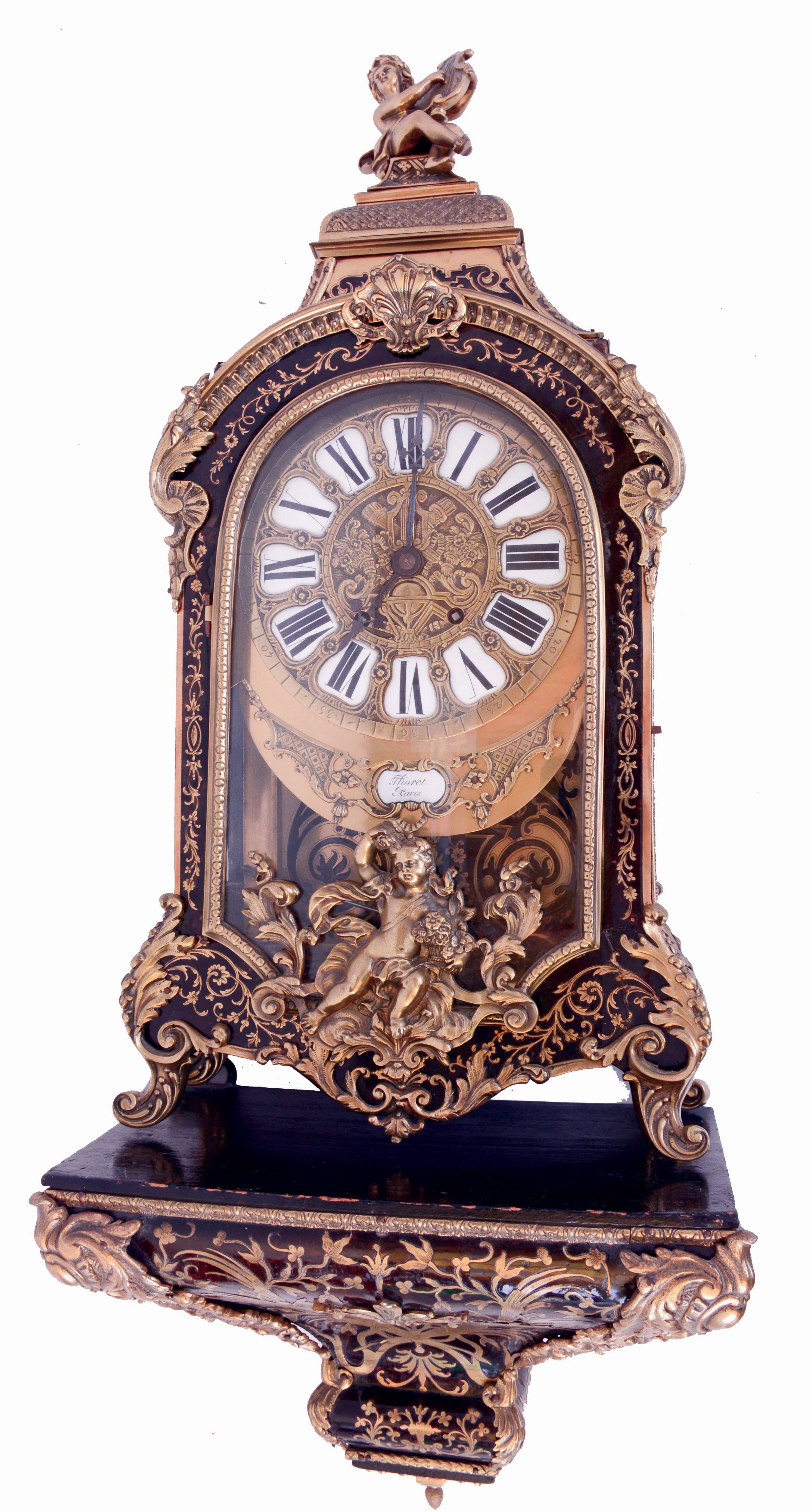 Bracket clock in the Louis XV style, boulle work case mounted with cast ornaments in the rococo style, the top with lyre playing putto, interior of the case also with boulle work, with its original, boulle work wall bracket, brass dial with Roman numeral cartouches and blued steel hands, signed "Thuret a Paris", 8 days, time and strike, spring driven movement with Brocot escapement, the back plate marked "Roblin &amp; Fils Freres a Paris", c1870 — Antique Clocks Price Guide