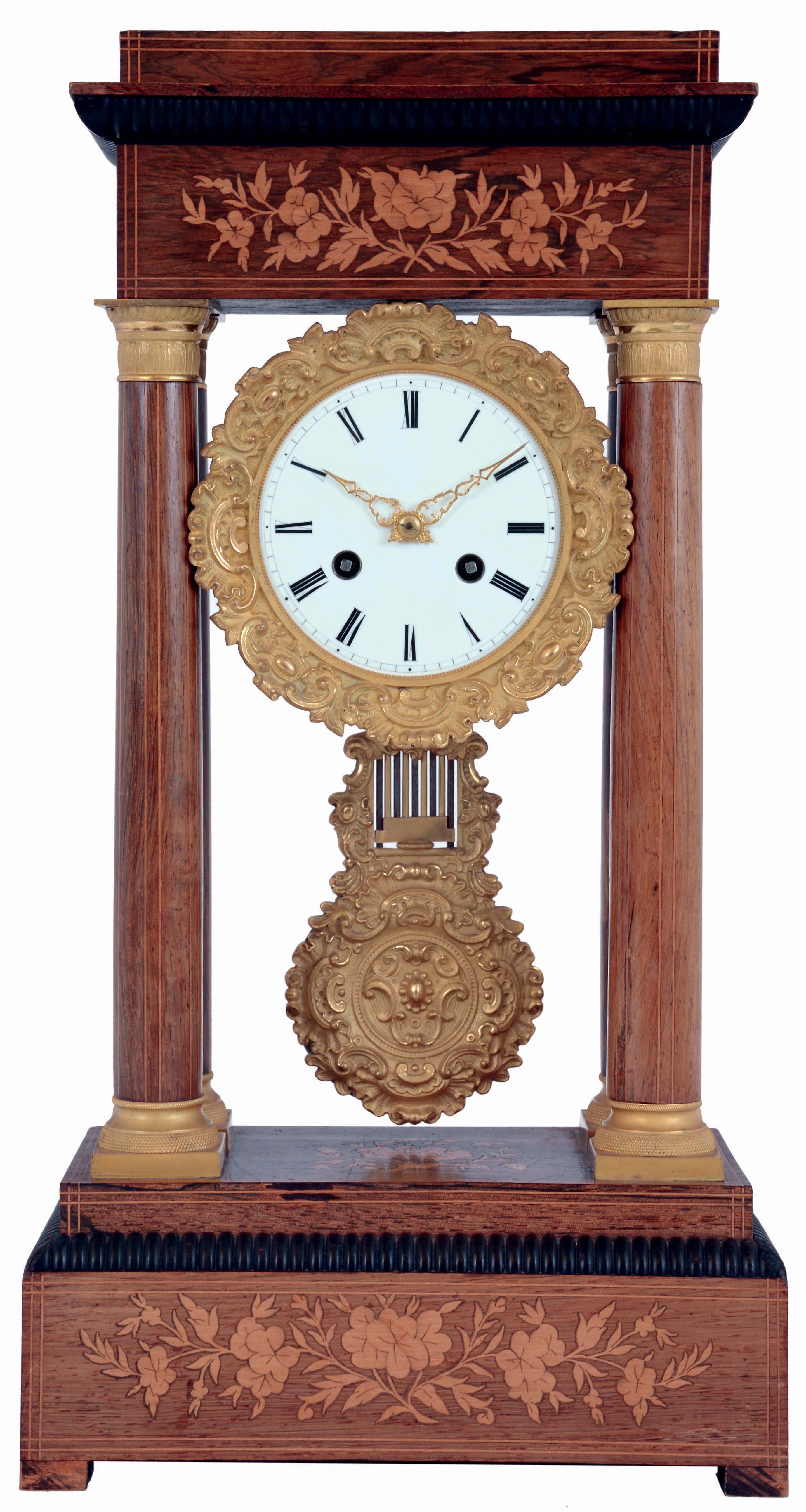 France, portico clock, rosewood veneered case with contrasting stringing and floral inlays, columns with gilt capitals and bases, top and base with ribbed, ebonized quarter round molding, gilt bezel and pendulum with leaf and scroll design, Roman numeral white enamel dial, gilt hands, 8 days, time and strike pendule a Paris movement marked Vincenti and Roblin a Paris, c1870 — Antique Clocks Price Guide