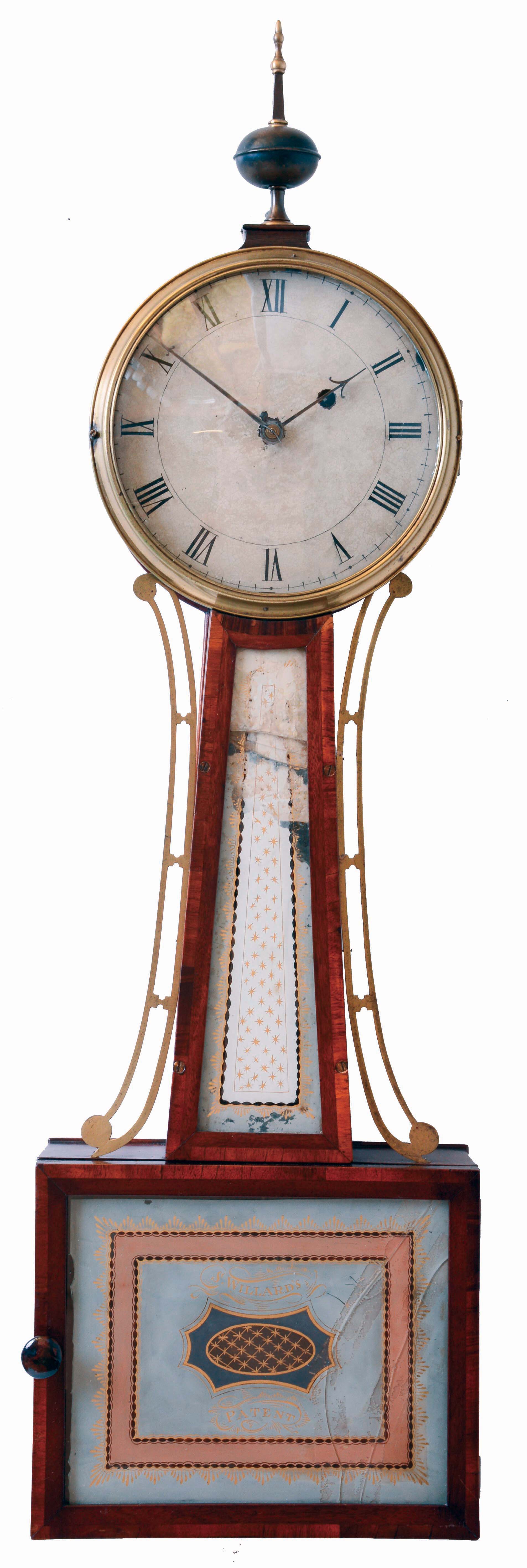 Boston 8 days, weight driven brass movement patent or banjo timepiece, c1825. Possible Simon Willard banjo as it is early with a head that is a uniform 1/2 inch thickness and has a very thin backboard. The movement has T-bridge suspension, through bolts to secure the movement. There are holes in the keystone for a crossbar. The throat frame is rabbeted on the back side and recessed into the sides of the case and anchored to the case with four screws. The door is latched to the case with an L-turn. — Antique Clocks Price Guide