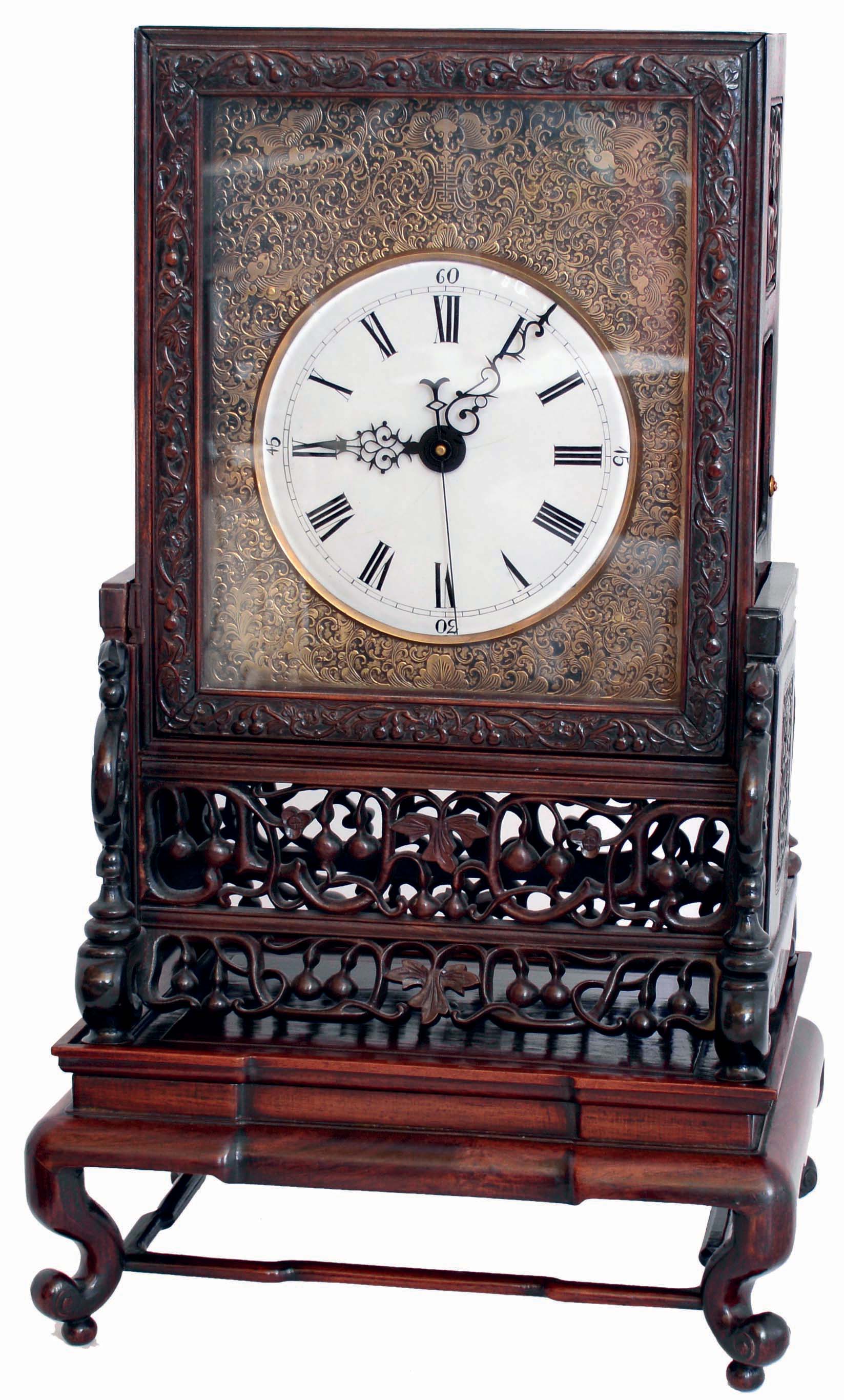 Chinese Large Bracket mantel clock, 8 days, time and quarter strike on two bells, spring driven movement with fusee, verge escapement and center sweep in a three piece Chinese highly and well carved rosewood case including bracket and swivel base with white enamel dial and engraved brass dial surround, circa late 19th century, some parts later — Antique Clocks Price Guide