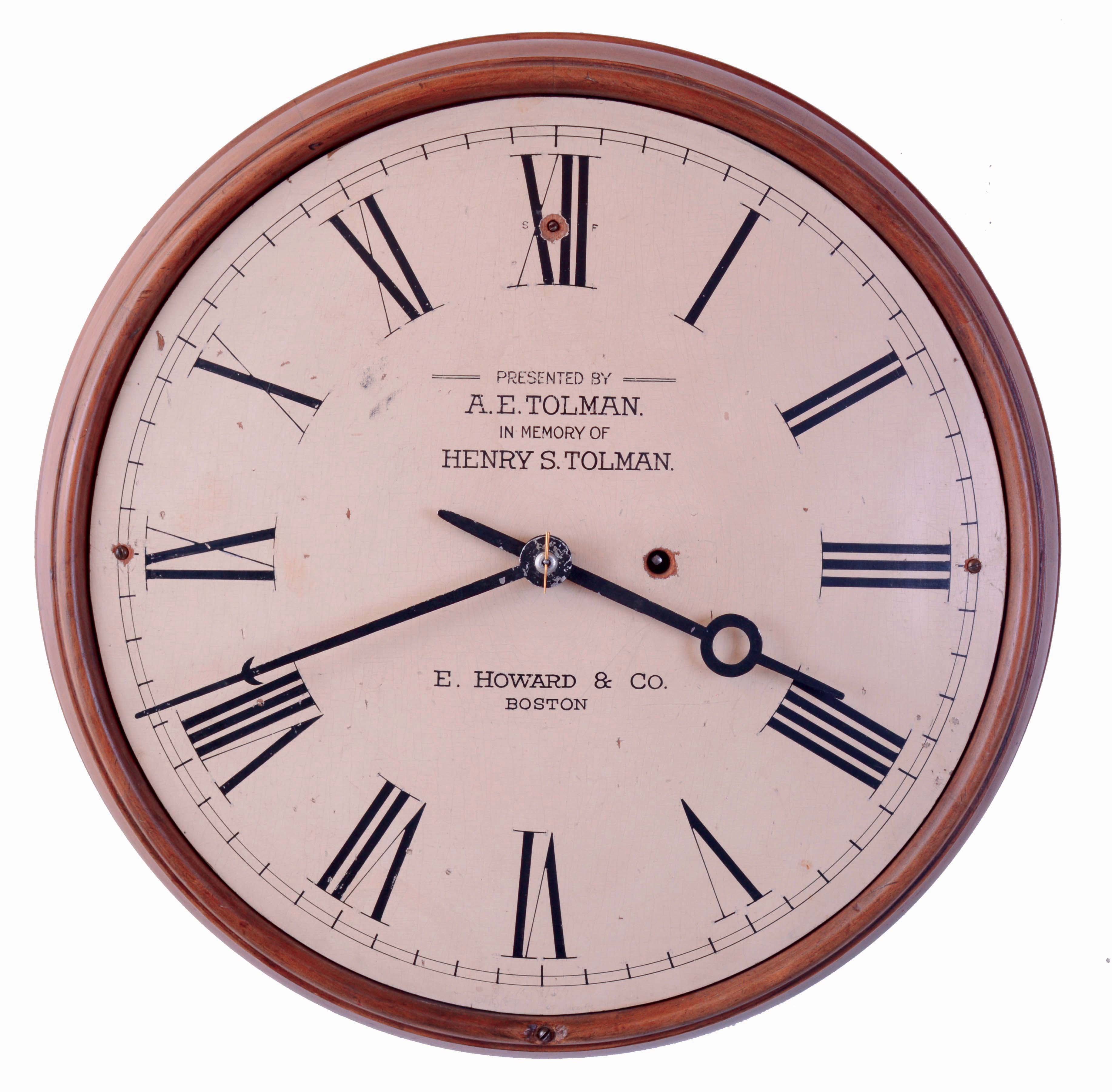 E. Howard &amp; Co., Boston, Mass., gallery clock, turned pine case, Roman numeral, white painted wooden dial with presentation below 12:00 "Presented by A.E. Tolman In Memory of Henry S. Tolman", 8 days, spring driven, nickel plated timepiece movement, the front plate marked "E. Howard &amp; Co., Boston 8 3/4", c1925 — Antique Clocks Price Guide
