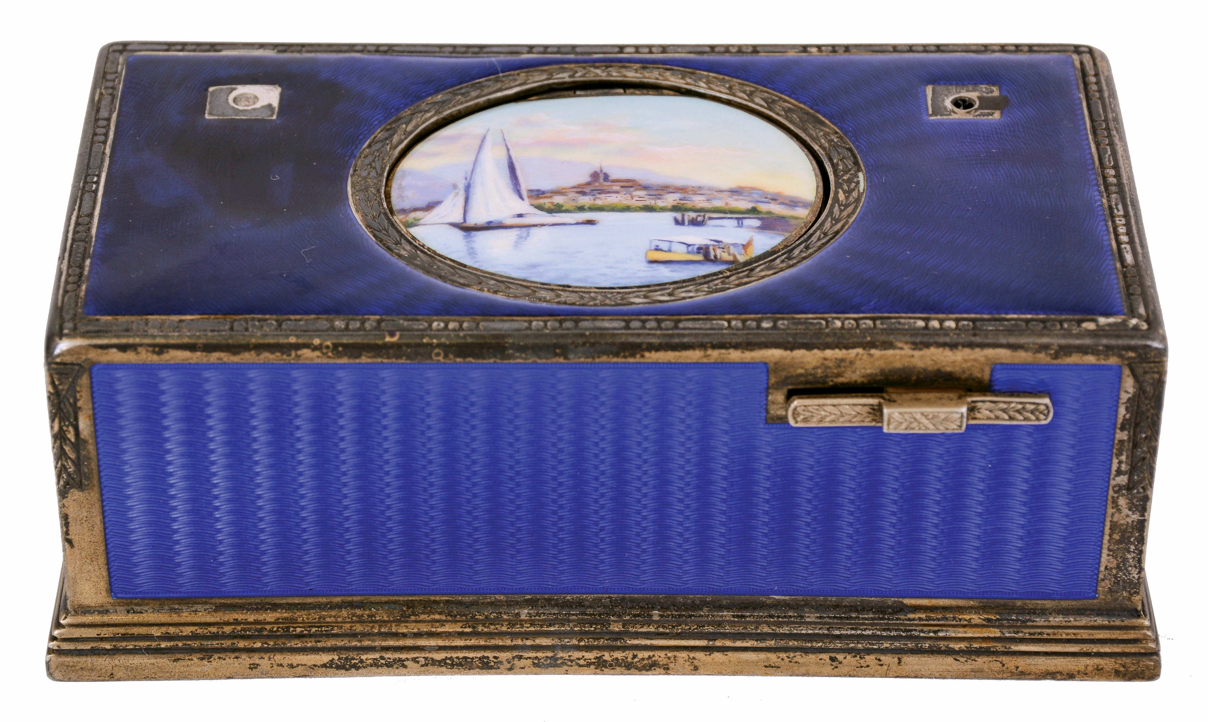 Switzerland, singing bird box, silver gilt case with blue guilloche enamel, oval lid with polychrome enamel harbor scene concealing a bird with brightly colored feathers, appearing and performing on demand, 4 1/8" x 2 1/8" x 1 5/8", 20th century — Antique Clocks Price Guide