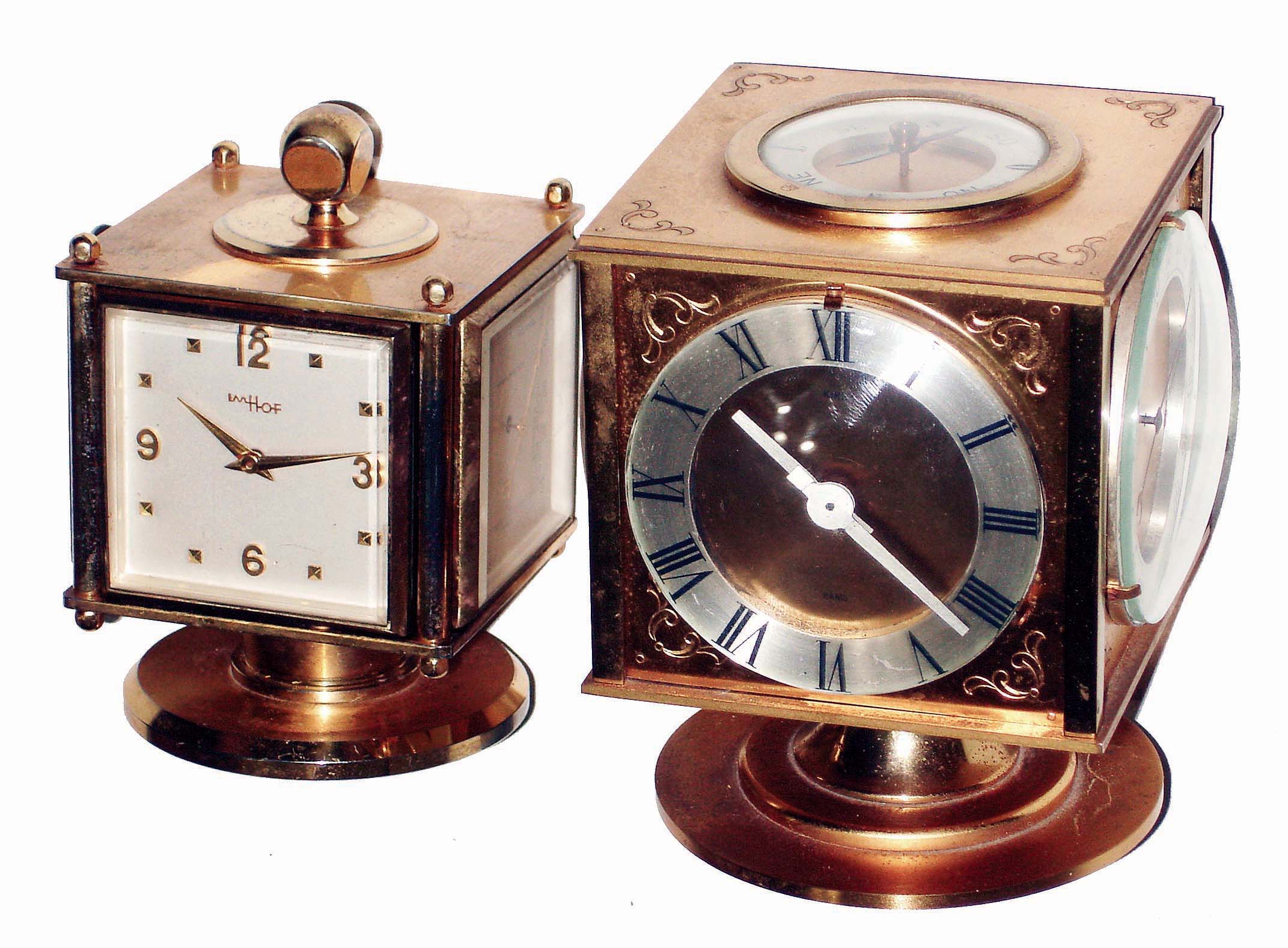 Clocks- 2 (Two): brass with weather stations, swiveling multidial instruments with 8 day timepieces, hygrometer, barometer, thermometer: Kirby, Paris, with top compass; Imhof Swiss; mid 20th century — Antique Clocks Price Guide