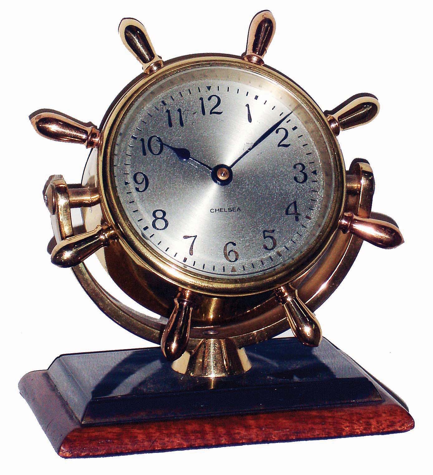 Chelsea Clock Co., Boston, Mass., "Comet", brass on mahogany base, 8 days, time only swivel head yacht wheel desk clock, c1948 — Antique Clocks Price Guide