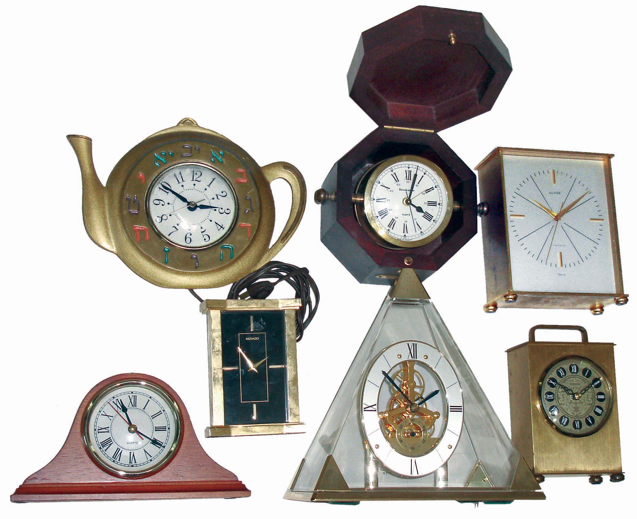 Clocks- 7 (Seven) small plug-in and battery-powered modern clocks: Movado and Luxor brass cases; Brookstone German boxed marine; Seiko pyramid; Israeli teapot wall clock; etc. — Antique Clocks Price Guide