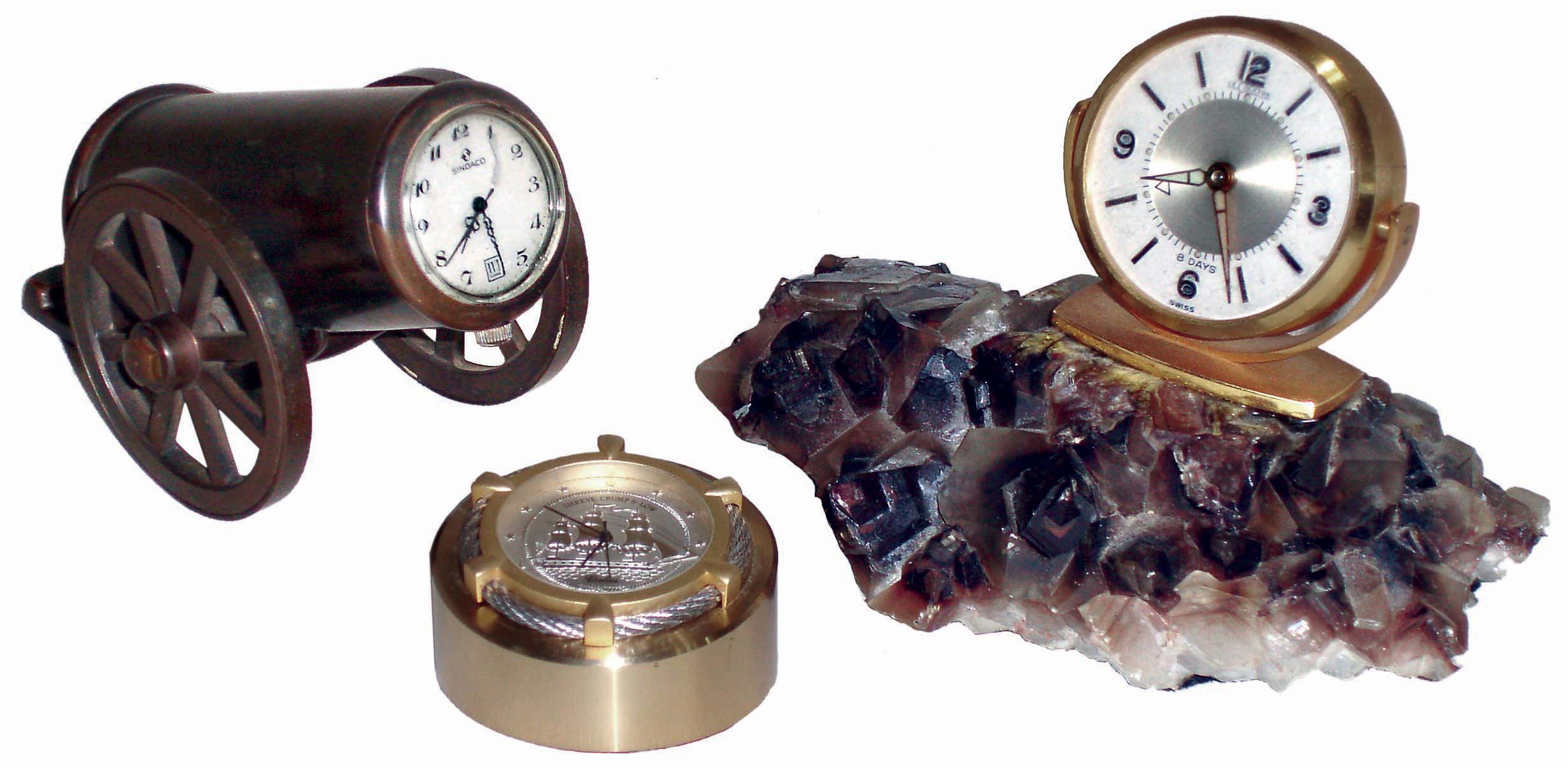 Clocks- 3 (Three) modern novelty clocks: Sindaco Swiss 1-jewel in bronze cannon; Chelsea/Shreve, Crump &amp; Low small nautical theme with Japanese battery movement; LeCoultre 8 days, alarm clock on rock crystal base; 20th century — Antique Clocks Price Guide