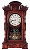 Seth Thomas Clock Co., Thomaston, Conn., "Hecla" mantel clock in a walnut case with a three train, 8 days, spring driven movement, striking the quarter hours on 2 cup bells and the hours on a cathedral bell, c1884.