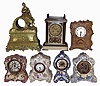Clocks & Statues- 21 (Twenty-one): 4 cast metal seated figures; 1 French gilt metal case (no movement); 4 American porcelain case; 1 onyx French sold by Camerden & Forester, New York; Seth Thomas Art Nouveau metal case; 1 400 day; French marble with balance wheel Duverdrey & Bloquel movement; 6 small celluloid desk clocks; 1 United movement with animated dial; French alabaster and gilt metal figural; late 19th and early 20th centuries