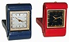 Clocks- 2 (Two) Swiss Gubelin, 8 days, 15 jewel alarm in folding leather cases; one has calendar window; 20th century