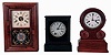 Clocks- 3 (Three) American: (1) Chauncey Jerome, 30 hours, spring driven brass movement with a brass mainspring cottage timepiece, c1850; (2) E. Ingraham & Co., 30 hours, time and strike, spring driven brass movement "Grecian" shelf clock, c1875; (3) Seth Thomas, "Round Band" 30 hours, time and strike, with round plate movement, c1870.