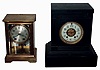 Clocks- 2 (Two) Seth Thomas, 8 days, time and strike mantel clocks: black marble with round movement; "Empire No. 201" brass and beveled glass crystal regulator; c1900