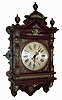 Lenzkirch, Germany, gallery clock, or Gutsherren Uhr, architectural oak case with applied cast ornaments, top with turned finials, also with applied brass decoration Roman numeral silvered dial, black painted steel hands, 8 days, time and strike movement, serial #871393, c1890