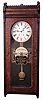 E. Howard & Co., Boston, Mass., "Watchman's Clock" with punch stations for two watchmen, wall clock, 8 days, time only, weight driven movement in an oak case with painted metal dial and reverse lettering on glass, c1888