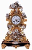 France, decorative mantel clock, the case of gilded and silvered stamped brass foliate elements in the rococo style, and with porcelain flowers, Roman numeral white enamel dial, fancy gilt hands, 8 days pendule a Paris movement with silk thread suspension, striking on a bell, the back plate marked "B & C Paris", mounted to a velvet covered wooden base with gilt feet and central ornament, c1850