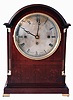 Elliott, London, bracket clock, mahogany case with with fine inlay in the neoclassical style, engaged quarter columns with brass capitals and bases, cast brass feet, handles, and frets, the bezel with convex glass, Roman numeral silvered dial with blued steel Breguet style hands, massive three train fusee movement with Westminster chimes at the quarters on four gongs, and counting the hours on a larger gong, c1900