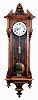 Austrian, Schonberger, large single weight 8 days timepiece with 9 inch dial (10" bezel), in a long, 66 beat case, the case of walnut solids and veneers, and with unusual carved pendulum stick, c1875