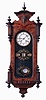Germany, calendar wall clock, 8 days, time, strike and perpetual calendar, spring driven movement in a mahogany case with white enamel dial and reverse painted glass, c1870