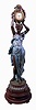 Large French floor figural case of standing woman on a wood base holding above her head a pot with garlands of flowers in which there is a clock- now with a Boston Clock Co., 8 days, tandem wind, time and strike, spring-driven movement with multi-colored dial, c1900