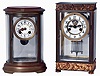 Clocks- 2 (Two): (1) French, Marti & Cie, 8 days, time and strike, spring driven brass movement crystal regulator mantel clock. (2) Waterbury Clock Co., Waterbury, Conn., "Aubert", 8 days, time and strike, spring driven brass movement crystal regulator mantel clock.